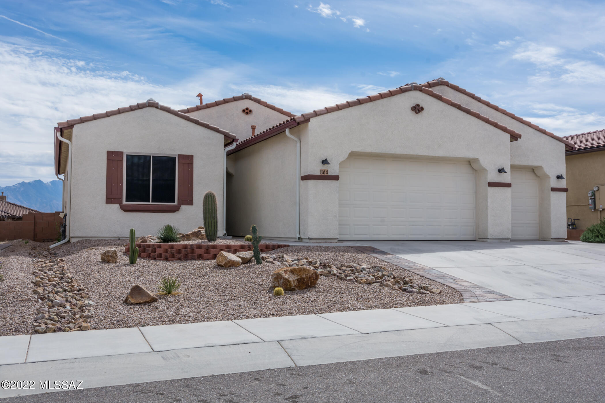 This home is elegant and  it has playful colors and touches.  Don't mistake this for the ordinary, it has more than $ 125000 in upgrades including an $18000 lot premium.  Part of the Green Valley Recreation centers with pools, tennis, pickleball, fitness and many sports.  Here I will highlight only a few of the 50 upgrades: 3 car garage with a 2ft extension, a service door for the 3rd garage, large covered patio, recirculating hot water heater, insulation in the garage, quartz counter tops and stone sink, ,grab bars, epoxy garage floor, 4 stage water system,  wall bed & desk with shelving,  gutters,
a 4 ft. extension at the 2nd bedroom and  much more. Enjoy the finished backyard and the big patio and mountain view inside and out.  This home is totally unique!