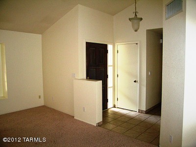 Eastside Single Story 3 Bedroom 2 Bath Home. Contemporary style, vaulted ceilings, and Raised Hearth Fireplace in Family room. Spacious Kitchen with breakfast nook. Large Dining Area, Living Room with cozy window seat, AC, 2 Car Garage, W/D hookup and close to shopping. Extended covered Patio and Block wall backyard. (Broadway/Houghton)