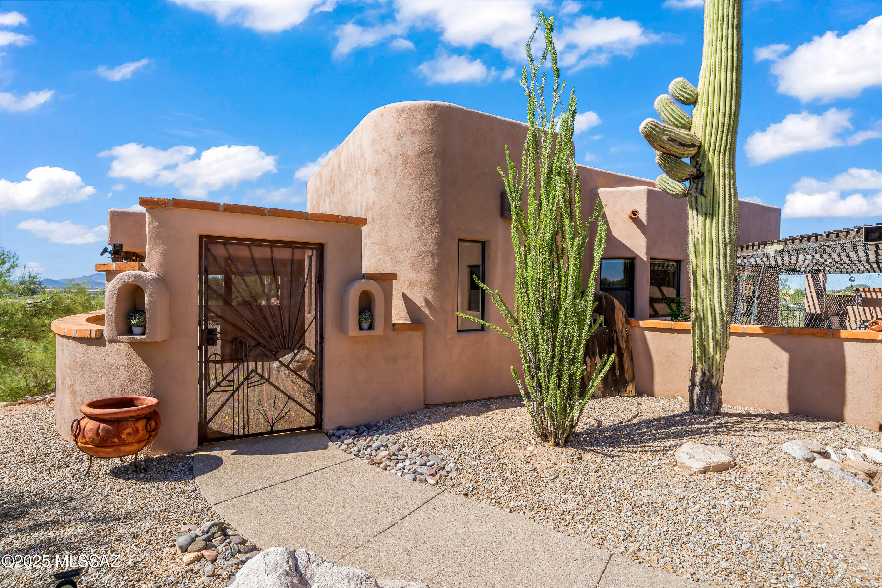 Welcome to 30 W. Stone Loop, a bright and lofty ridge-top home offering unparalleled sunrise and sunset views over Tucson.  Nestled on nearly 2 acres at the base of the Santa Catalina Foothills, 3 bedroom/3 baths,this home boasts an open-concept design with soaring ceilings and abundant natural light.  The gourmet kitchen is a chef's dream, complete with a professional Viking stove for culinary excellence.  The expansive patio is perfect for entertaining, relaxing or simply soaking in the breathtaking mountain views.  A private guest house adds extra flexibility-ideal for visitors, office, or rental potential.  Conveniently located near essential amenities, including a gas station, and shopping at the nearby mall.  this house offers both privacy and accessibility.