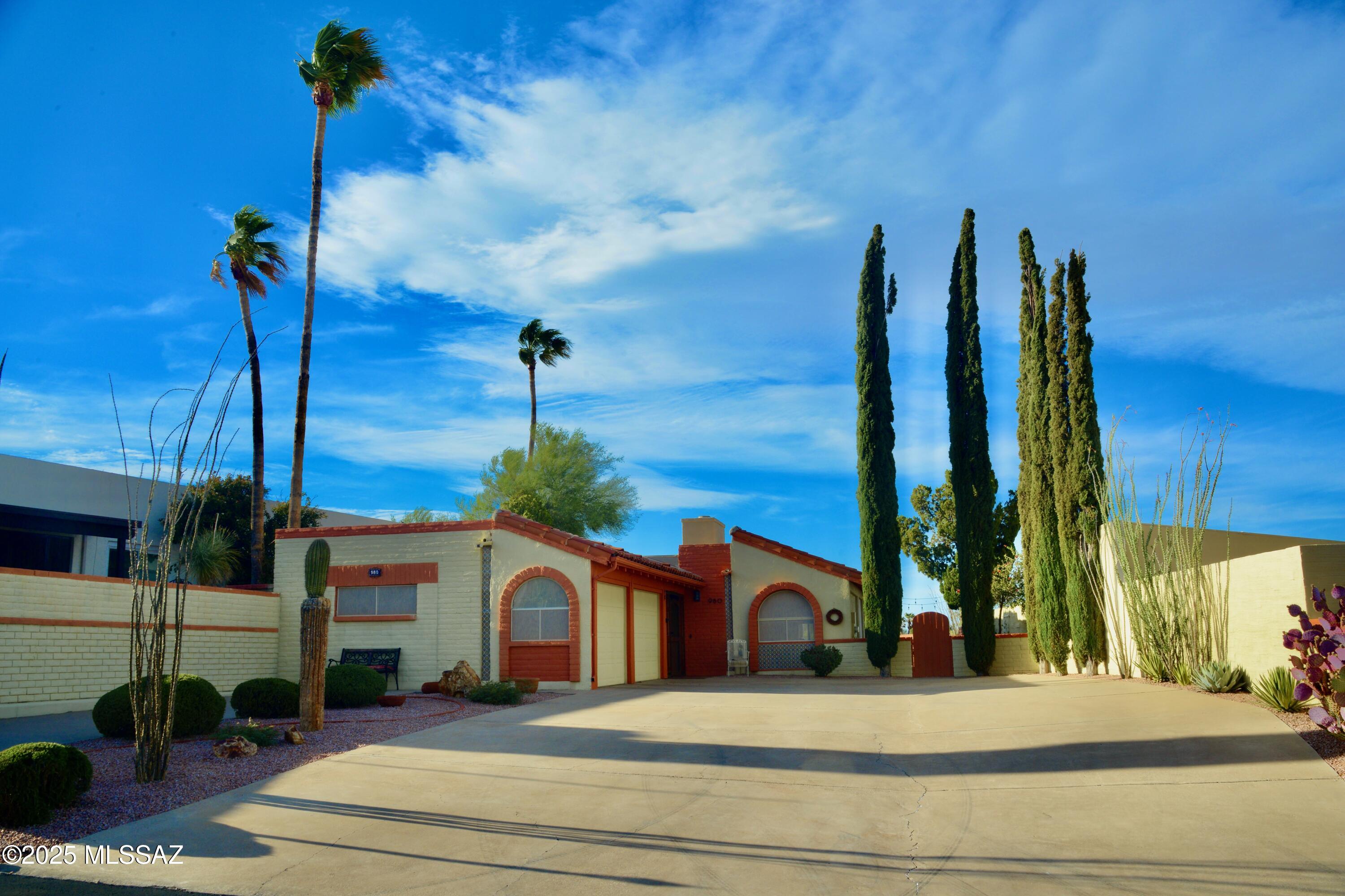 VIEWS, VIEWS, VIEWS! Soak in stunning 180° mountain views from this fully furnished, modern mid-century 2 bed, 2 bath + den gem! This stand-alone beauty backs to the golf course with a spacious bricked patio, multiple sitting areas, and both covered and open-air space to relax or entertain. Inside, clerestory windows flood the home with light, highlighting the cozy wood fireplace, updated kitchen, and both updated baths. The enclosed breezeway with wrought iron screen and glass front door adds charm and convenience when entering from the 2 car garage. Remote-controlled awning, blinds, and an oversized driveway offer comfort and ease. Roof recoated in 2024. 5-year warranty. See attached for full list of updates!