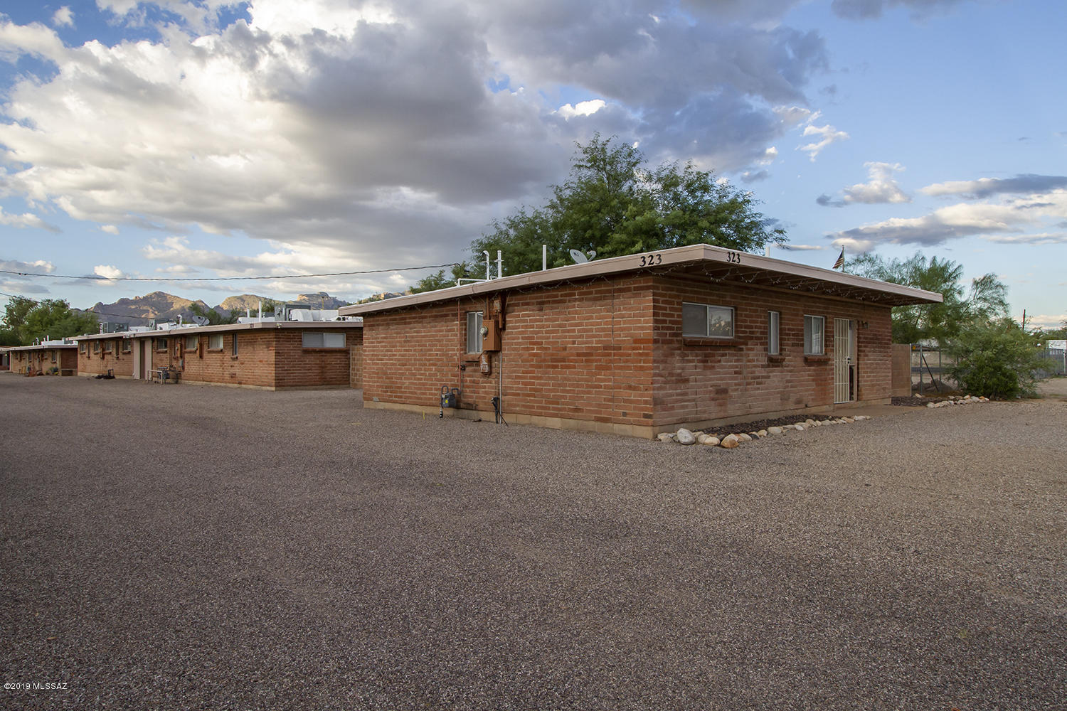 9 unit complex - two 3-bedroom units, six 2-bedroom units, and one fully remodeled 3-bedroom 1920 sq ft single family home w/ large yard!

This property has been owner-managed for decades and treated with love, with consistent service to the mechanics and structure of the property. This is a turn key investment, FULLY occupied, well kept, 1 acre, 9 unit apartment complex. Its central location, lovely private yards and the convenience of off-street parking, paved walkways, natural desert landscaping, central heat/AC and an overall sense of privacy means you don't have a high turnover rate; tenants call this home! New gas lines 2018, upgraded electric, and laundry hook-ups for each unit.