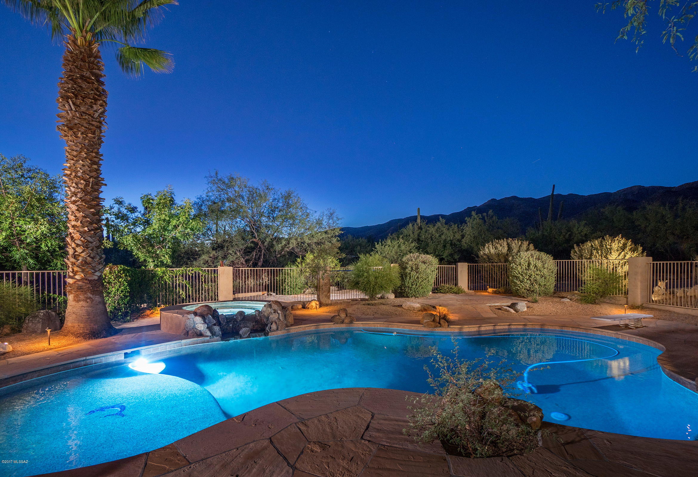 LOCATED IN THE HIGHLY SOUGHT AFTER MAKOHOH ESTATES, ENCOMPASSING 1.25 ACRES, ADDS TO THE FEEL OF THIS SECLUDED ESTATE, OFFERING COMPLETE PRIVACY FROM OUTSIDE TO IN, WITH LUSH MATURE VEGETATION, SITTING BEHIND A PRIVATE GATED ENTRY. THE MAIN HOUSE IS COMPRISED OF 4 BDRMS & 3 BATHS, FORMAL LIVING & DINING RMS & SEPARATE FAMILY RM, 2 FIREPLACES, GOURMET KITCHEN, W/ STAINLESS STEEL APPLIANCES & BREAKFAST NOOK. ALSO FEATURED IS THE 5 CAR GARAGE (3 MAIN HOUSE & 2 DETACHED GARAGE) AND FULLY OWNER SOLAR POWER. THE GUEST HOUSE W/ PRIVATE ENTRY, IS EQUIPPED W/ KITCHEN, LIVING RM, BDRM & BA. THE LARGE OUTDOOR KITCHEN AND DINING PAVILION, W/ BBQ OVERLOOKS THE SPARKLING, SUN FILLED POOL & SPA, SURROUNDED BY LUSH GROUNDS & MTN VISTAS BEYOND. A MUST SEE HOME!