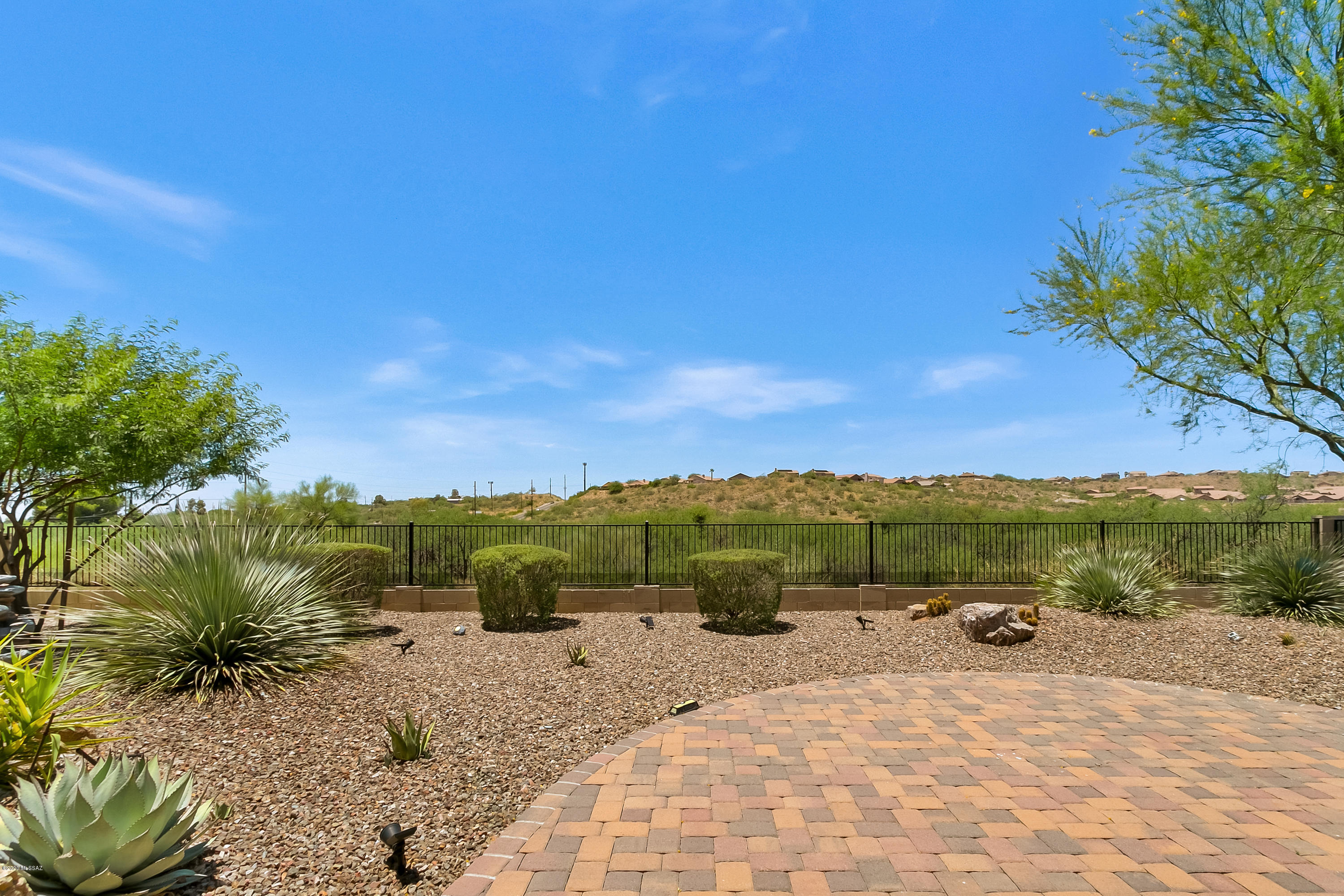 We are proud to present 2014 Pima home available for sale in MountainView Section of SaddleBrooke HOA 2 with desirable 2,344 SF and spacious 2.5 car garage. 2 bedrooms plus den & 2.5 bathrooms. Expanded master bedroom has bay window & private door to patio. Your guests will be delighted to enjoy their own private quarters with en-suite bath. Beautiful Kitchen with large oversize island, walk-in pantry closet, granite counters, abundance of cabinets & stainless appliances. Need a big laundry room with sink? Here it is. Ceramic tile wood plank floors, screened porch & electric rolling sun screens. No neighbors behind this home since it is located on wide open spaces. Conveniently located just a short distance to fitness center and swimming pool. Ready for you to move in.