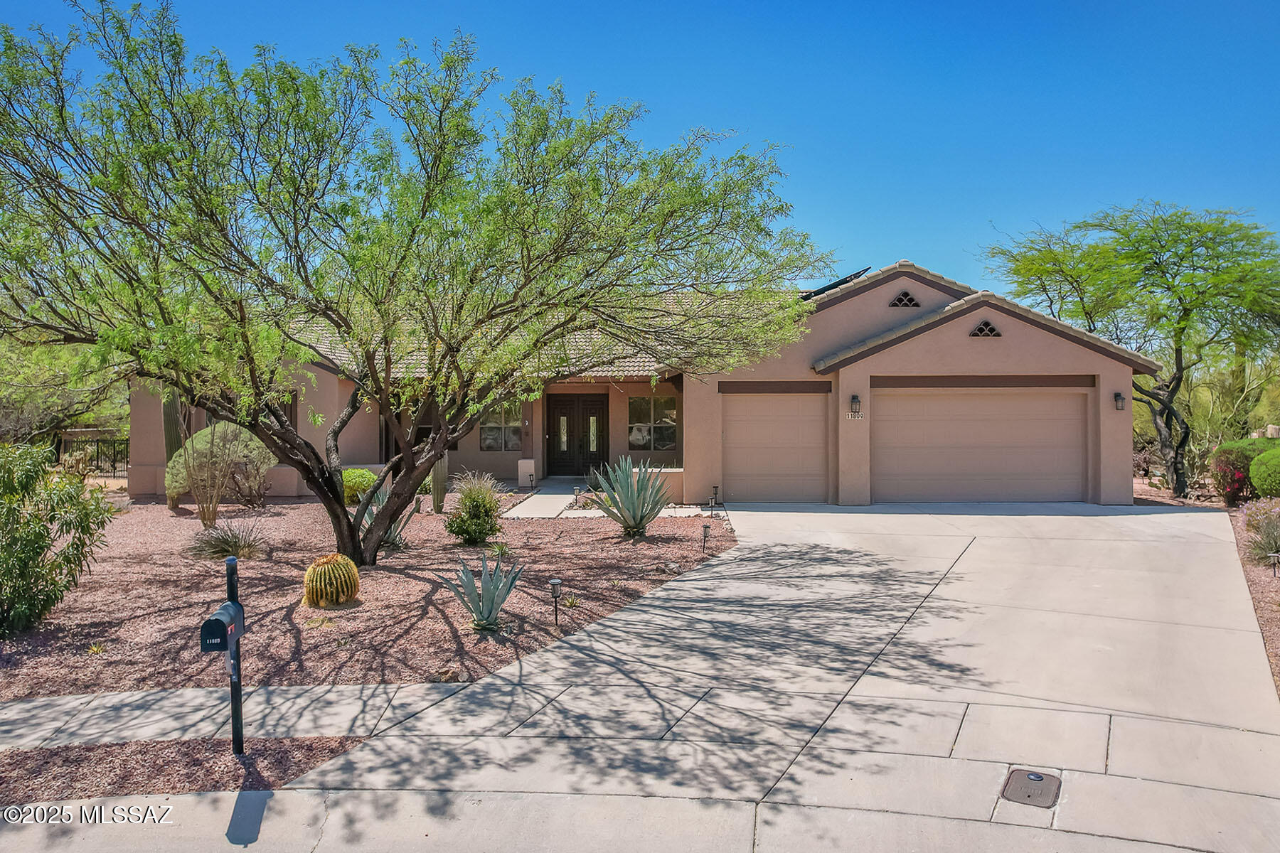 Spectacular 4BD/3BA +Office (3,002 sf) home on large .69 acre cul-de-sac lot in the heart of Oro Valley boasts owned Solar, dual primary suites, plus resort-style yard with solar heated pool, spa and more! Striking foyer with inlaid tile is flanked by formal living spaces. Beyond lies an open concept Great room with walls of windows, fireplace surrounded by media niches, plus gourmet kitchen hosting center island with breakfast bar, granite counters, tall cherry cabinets, and SS appliances including dual ovens/gas cooktop/microwave. Main primary suite opens to rear patio and hosts a luxury bath with 2-way fireplace, extended vanity, deepset soaking tub plus walk-in shower & custom closet. Second primary suite with full bath opens to front porch with peeks of the Catalinas. Gorgeous office with built-in cabinetry accesses rear patio. 3 car garage plus laundry room with ample storage and sink. Additional amenities include alarm/keyless entry/security cameras, water softener, central vac, custom closets, tiled countertops in baths, 18" ceramic tile or engineered hardwood (no carpet) plus zoned HVAC. Retreat to a captivating, serene outdoor space beginning with an extended covered patio with sunshades. Outer patio boasts Travertine tile, koi pond with rock water feature, mature desert landscape, shade trees, fan palms plus citrus trees at side of yard. Main patio is flanked by a gated side yard with gas or solar heated pool & spa plus peeks of the Catalinas. Community playground nearby plus Naranja Park, walking/biking paths, schools, shopping, dining & entertainment. A true desert retreat!