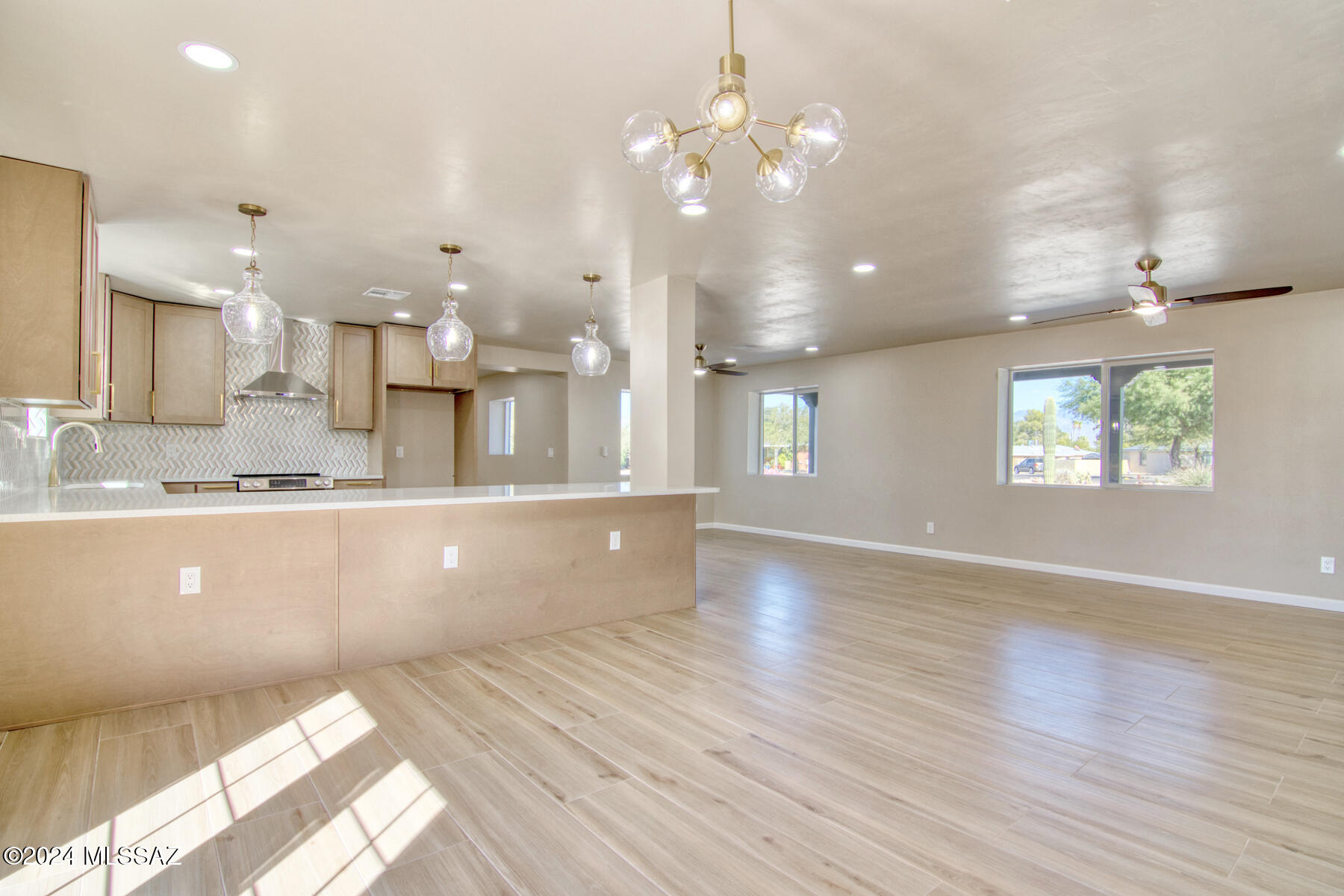Range priced seller will accept or counter offers between $495,000-$515,000. Incredible remodeled central Tucson home. 1901 sq ft main residence and 550 sq ft attached guest house. The main house is 3/2 and the guest house is 1/1. Perfect for multi-generational living or rent out the guest house. Vacation rentals allowed.  There is more to this home than meets the eye. Huge .76 acre lot with no HOA. Plenty of room for RV, boat and toys. Completely redesigned and attention to detail throughout. Spacious living area with open great room plan. Spectacular kitchen with quartz counter tops, custom lighting, high end fixtures and finishings. All bathrooms remodeled and stunning. Huge fenced in yard and all on a corner lot with mountain views. This home is a rare find in central Tucson near