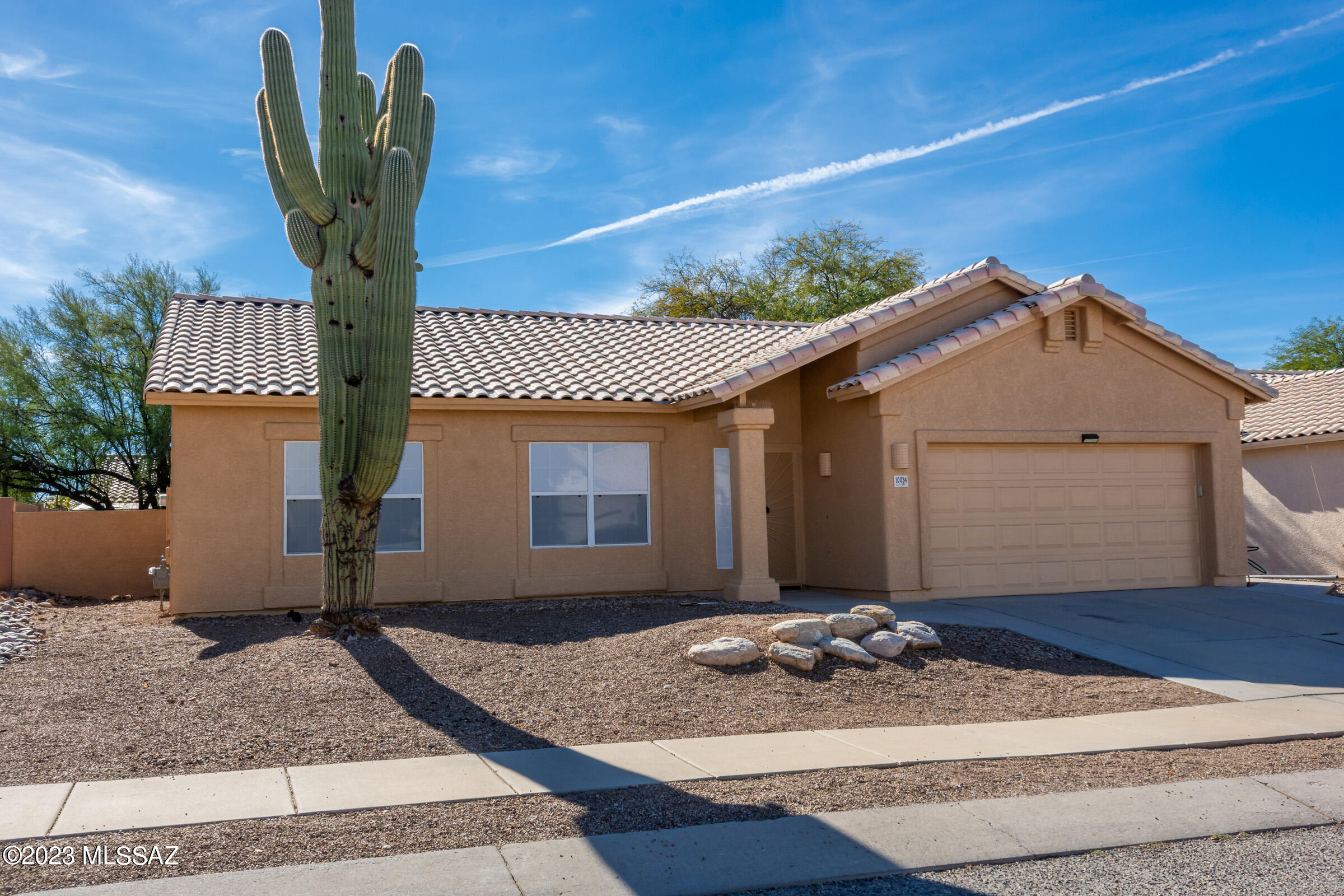Welcome to this lovely single story home with the perfect blend of comfort and affordability. Take in the high vaulted ceilings, tons of natural light, split floor plan, low care backyard and freshly painted exterior! Neutral colored large format tile in the kitchen, living room and baths make for the perfect blank canvas for personal touches. Nice sized kitchen with good storage, counter space and black appliances leads into the dining area, perfect for entertaining and enjoying casual meals. The 2 additional bedrooms can easily be an office, den or whatever suits your lifestyle. Outside, the large backyard is a private escape, featuring a covered and uncovered patio for your enjoyment. Some fresh paint inside and some new carpet will make it yours.