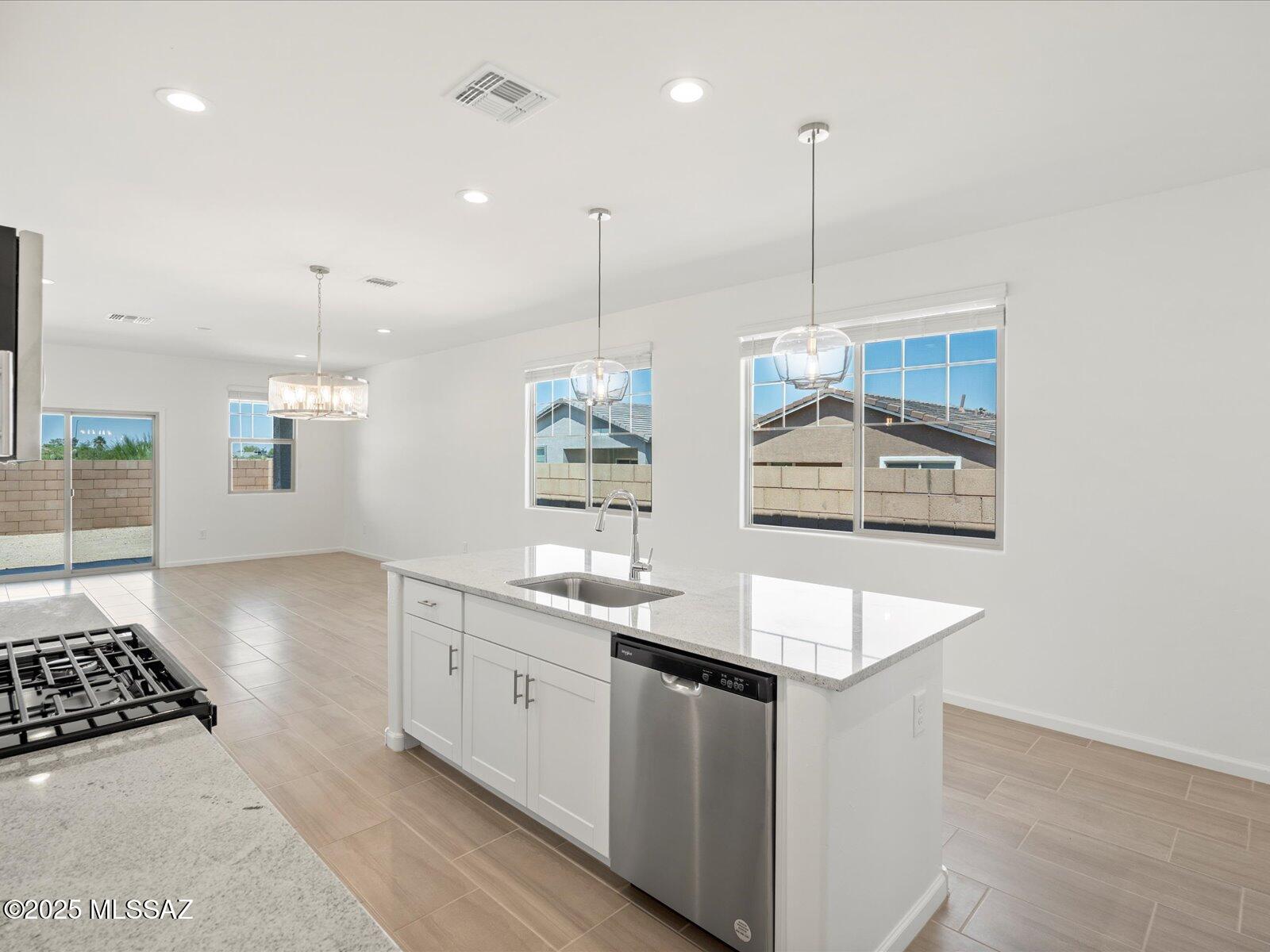 This beautiful 4-bedroom, 2-bath home features white cabinets, white and gray granite countertops, travertine-look tile flooring, and warm neutral carpet from our Cozy package. Rincon Crest at Rocking K is now selling in Vail, AZ! Located in the acclaimed Vail School District, this master-planned community offers five floor plans and amenities like pickleball courts, playgrounds, and a splash pad. Move-in ready with washer, dryer, refrigerator, and whole-home blinds. Every home is built with innovative, energy-efficient features for comfort, savings, and peace of mind.
