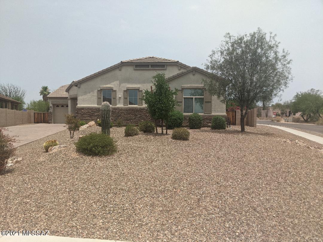 Stunning, highly upgraded home on .27 acre corner lot. The interior features include Gourmet Kit. with huge island, plenty of cabinet and counter space, granite counters and double ovens and a butlers pantry with a wine cooler. Great room has a sleek gas fireplace and custom built ins. Large den and spacious formal dining room . Split bedroom floor plan with huge main bedroom retreat, with spa like main bath and a massive walk in closet.  Two other bedrooms have a jack and jill bath, each with a private sink. Spacious backyard w/built in BBQ grill, mountain views and professional landscaping.  This is an AMAZING HOME, make it yours today!