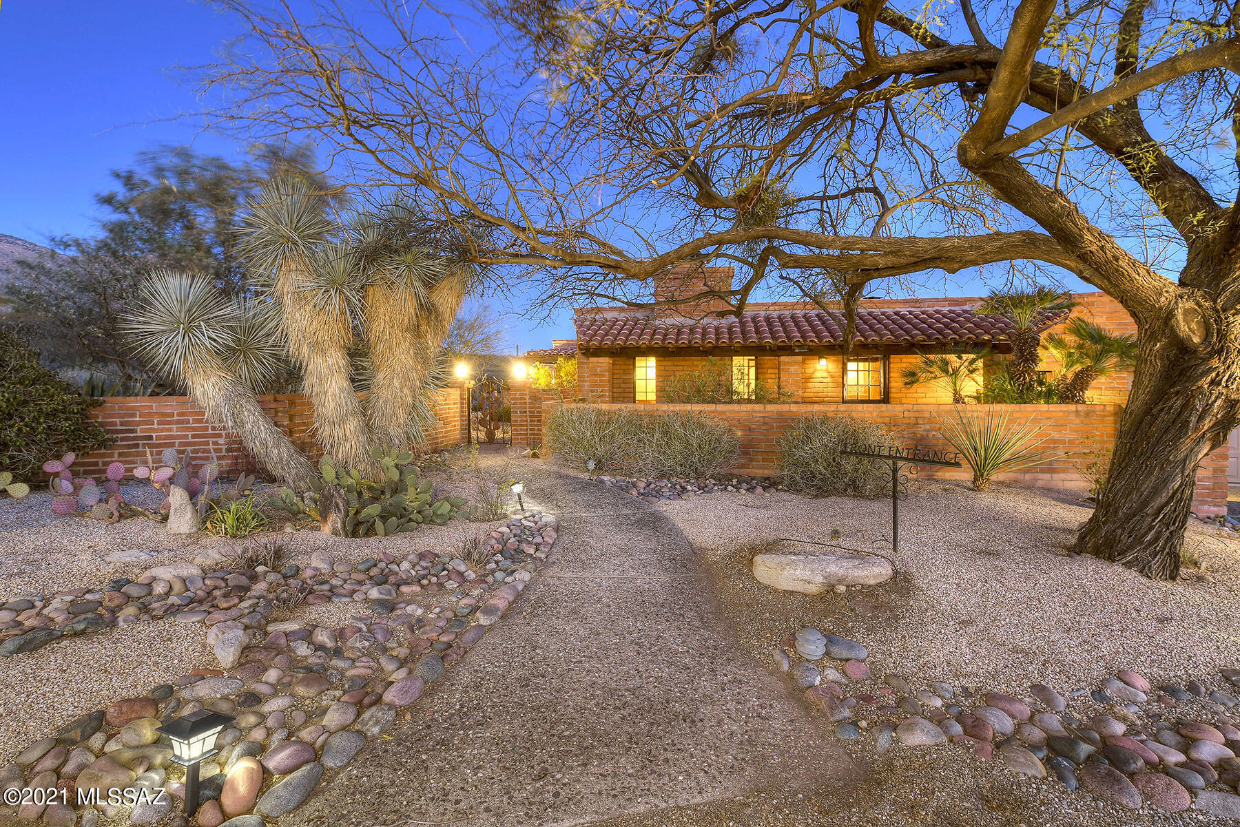 Authentic Tucson adobe block construction tucked away on a secluded lot,  surrounded by the beauty of the Catalina Mountains & sparkling city lights. This spacious floor plan offers large living spaces including 4 bedrooms, 3 baths & a Rec/Media room with a cozy fireplace & so many options for entertaining. The well appointed kitchen has new induction cooktop, solid wood cabinets & flows right into the family room. Formal dining opens to a private patio enhancing the many view corridors. Owners suite features a custom walk-in closet & remodeled bath. Retreat outdoors to the peaceful desert landscape and enjoy the extended covered patio overlooking the refreshing pool & spa. 3 car garage has extra storage.