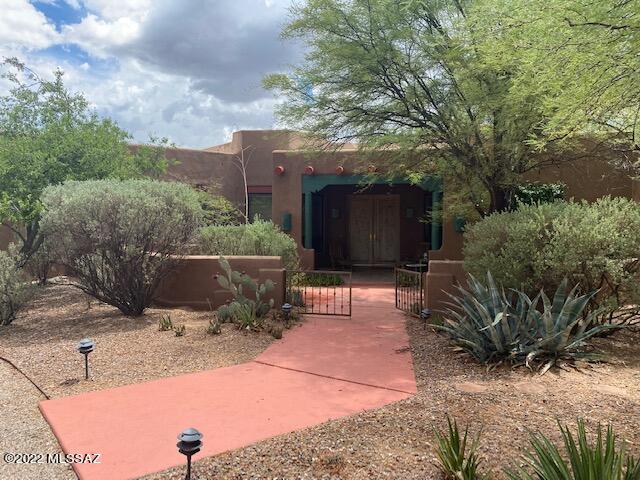 Beautiful courtyard entry, 4BR/3BA Santa Fe, 3205 sq. ft. on almost 1 acre lot in Powder Horn Ranch gated community with circular drive. High ceilings, 3 fireplaces including 1 Beehive in Master Bedroom, 1 outside FP on patio. Large. kitchen with huge Granite counters and island. Split bedroom plan, 1 bedroom with double doors adjacent to foyer entry used as office. Tile floors with carpeted bedrooms, large windows, 2 car garage, exceptionally beautiful back and front yard landscaping. Circular drive and awesome Western style wood gates leading to back yard, multiple patio areas, 8ft. double entry doors! One neighbor adjacent to property may board horses if you have any.
This home has so much character with NEW Vigas and beamed ceilings with Ocotillo lattice between Beams in Family Room.