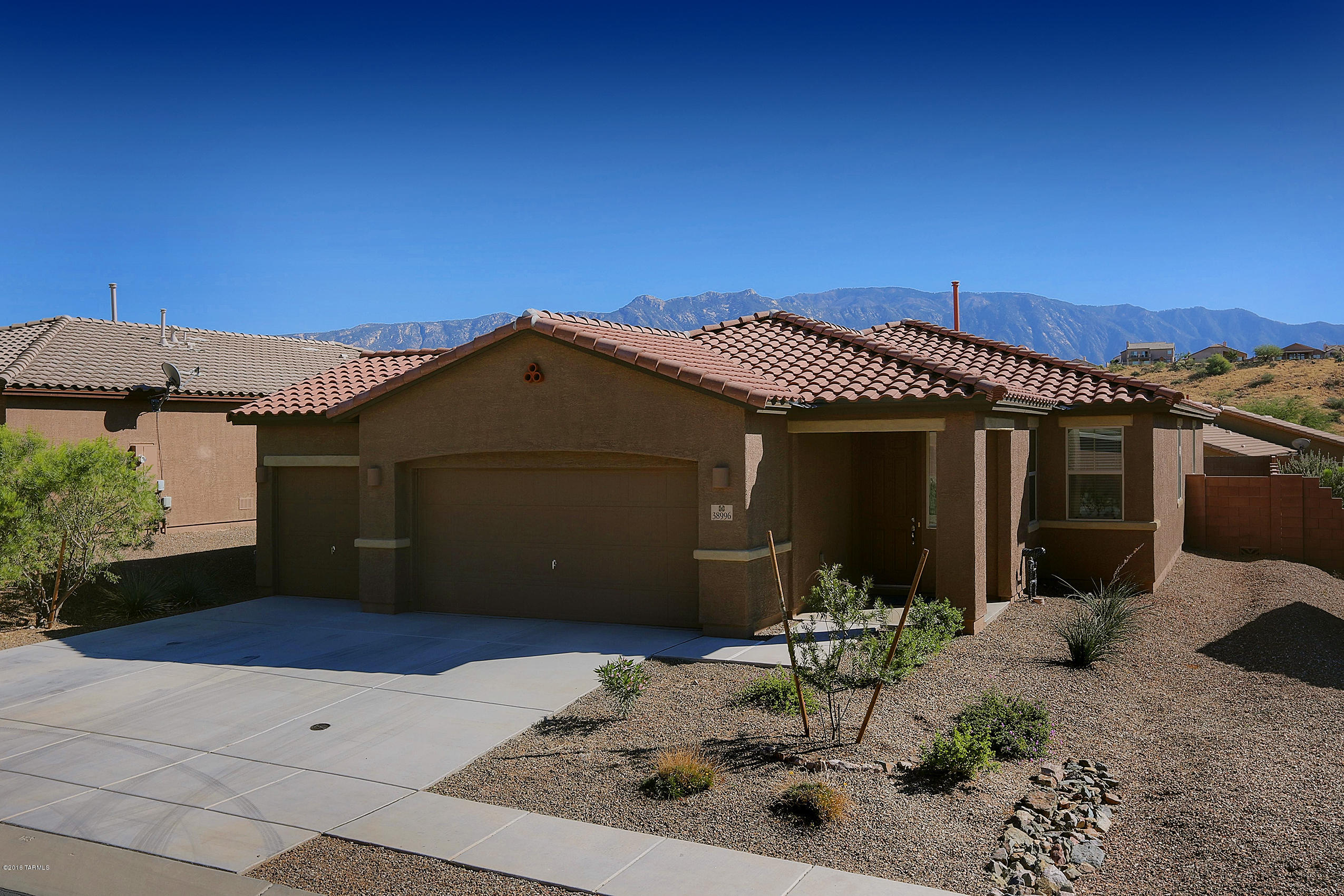 Stunning Catalina Mountain Views from this gently lived in, 3bd/2ba 2016 sq. ft. home in the Family Friendly community of Eagle Crest Ranch. The expansive great room invites you in with 9’ ceilings, custom tile, and professional paint. Updated Kitchen boasts stainless steel appliances, Granite counters, large pantry, recessed lights, and beautiful Maple cabinets! Sprawl out in the spacious Master Suite complete with garden tub, separate glass shower, dual vanities and a large walk-in closet w/built in shelves. Relax on the covered patio while viewing the beautiful Southern Arizona Mountains in the low maintenance backyard. Schedule your showing before this one is gone!