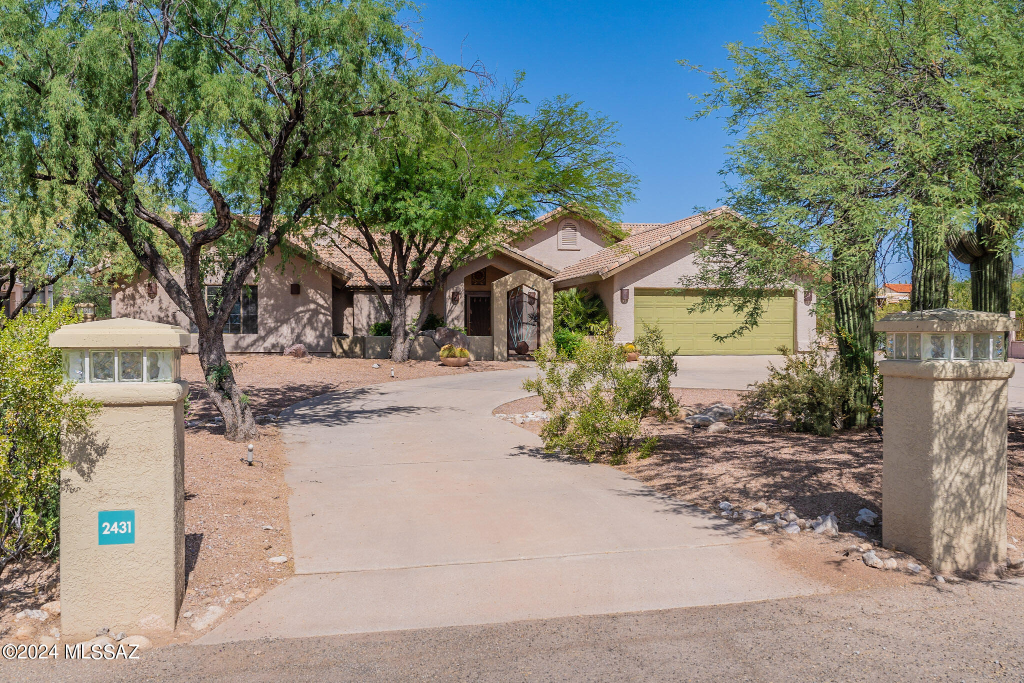 Custom 4 bedroom, 3 bath Home with so many EXTRAS! Huge SHOP with private gate comes with 2 car lifts, air compressor bathroom, RV carport and tons of parking in the motor court. Horse Facilities, Chicken coop, new turf and landscaped walled in back yard with covered patio and gazebo.  Dream kitchen includes, stainless stainless steel appliances, granite slab counters, 2 microwaves, double oven, warming drawer and breakfast bar  Custom lighting throughout, travertine floors, polished concrete, Office w/wet bar, family/game room, Built in cabinet storage & book cases, plantation shutters, vaulted ceilings, entertainment center, built in speakers!  ONLY STEP IS 3 INCHES INTO SUNKEN GREAT ROOM!   front Courtyard  fountain Guest house plans! OWNED SOLAR! Low Utilities! RV parking no HOA
