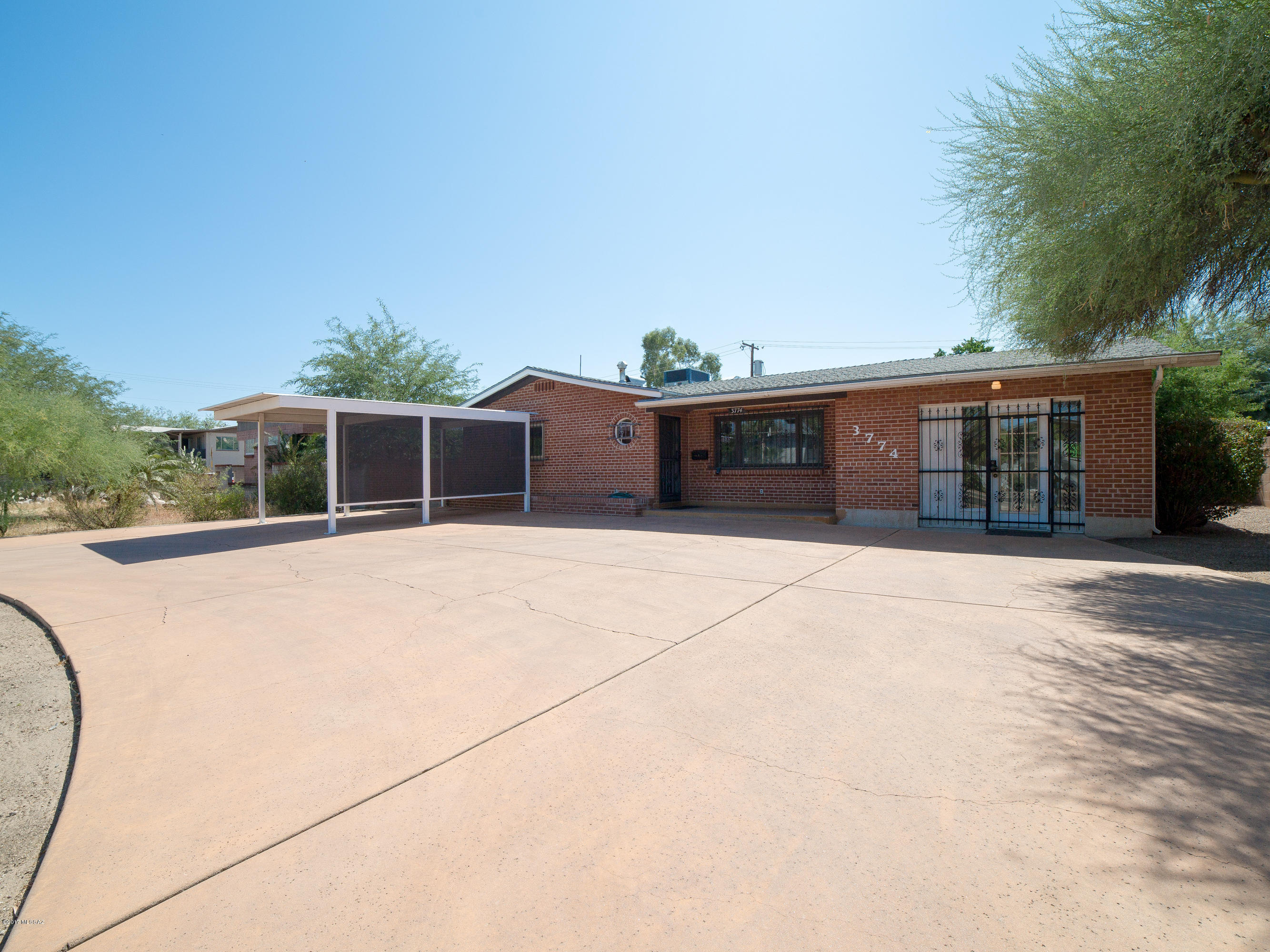 Not a cookie-cutter home, this 1957 ranch offers a variety of living options. The owner transformed the garage into an attractive finished room w/ built-in shelving, wood laminate floors & a separate entrance w/ double doors. It's ideal for a home-based business or can easily be converted to a 3rd bedroom by adding a closet. Heating & cooling already in place. Next to it is an updated bath w/ tiled shower & new vanity. Across the short hallway is another bonus room which may be used for storage or made into a work area. Formal DR is adjacent to kitchen & flows into the living area.  Wood parquet flooring creates a warm feel & circular troweled ceiling adds interest. Both bedrooms offer new carpet & cedar closets. The back yard is fully landscaped w/ decorative rock, trees & native plants. A custom Bominite patio has been added for outdoor entertaining & a large storage shed is great for storing tools & supplies. You must see this home in person to fully appreciate all it has to offer.