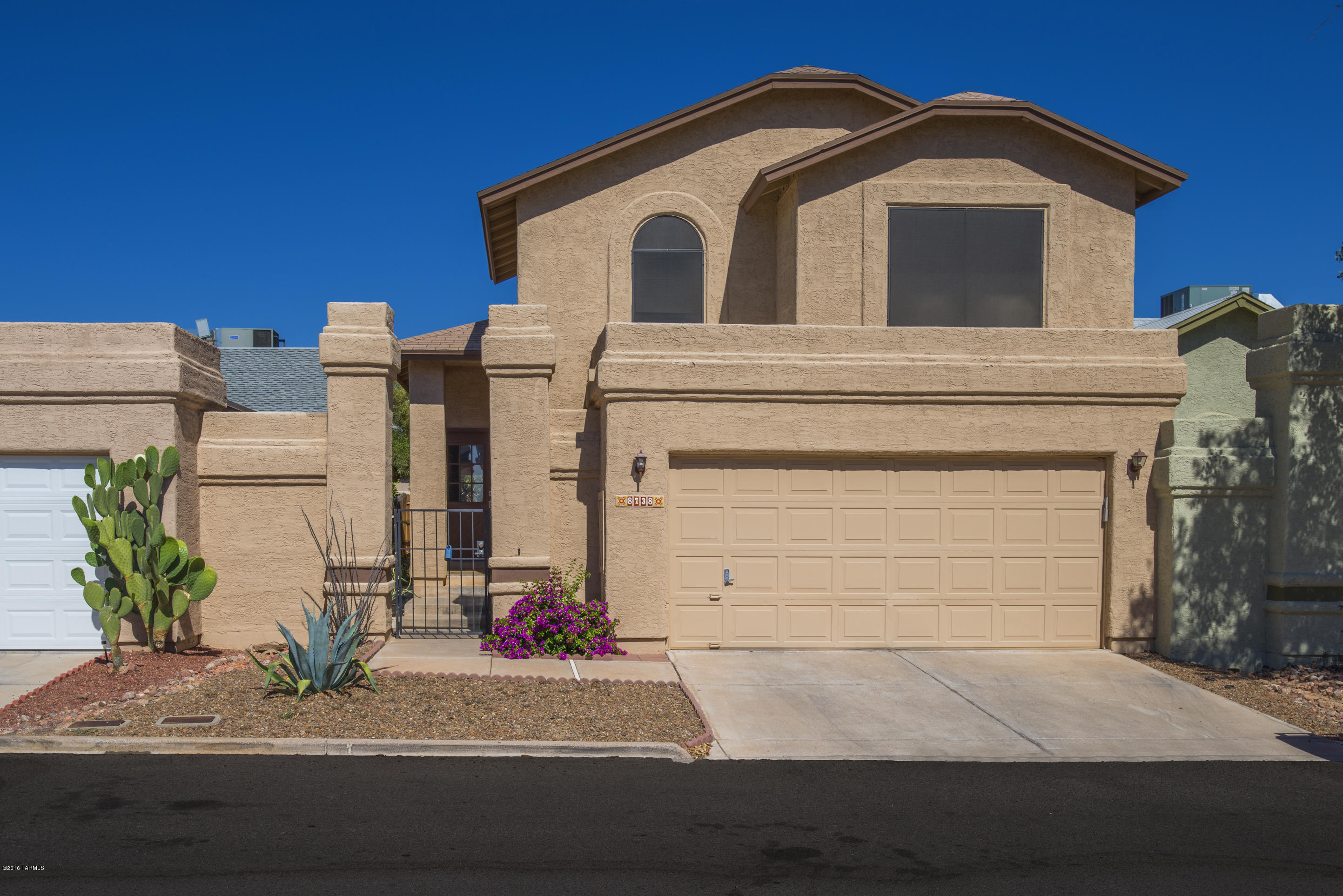Totally renovated two story townhome in Star Trails Est. This lovely home has wood and tile flooring. The ceiling have been redone, no popcorn here.  There are 3 bedrooms. Master bath has double lavs and executive height counters. The large oversized yard has wooden fencing.