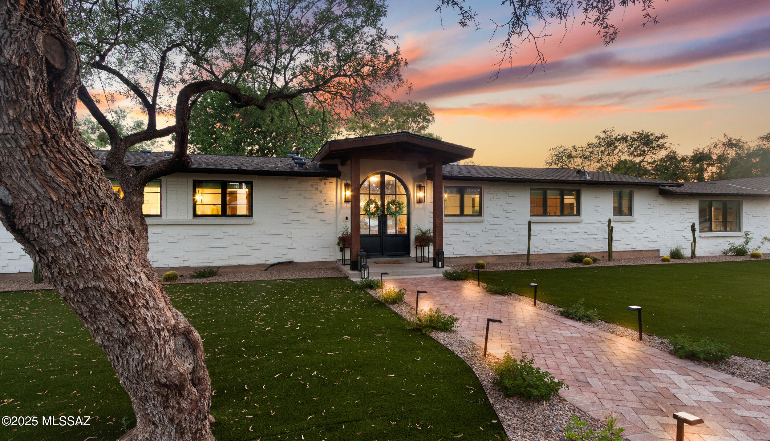 Enjoy luxury living in this spectacularly remodeled Tucson Country Club home, situated on a highly desirable street. Thoughtfully updated from top to bottom. Spacious primary suite boasts spa-like shower and soaker tub, sizeable family room off kitchen is ideal for gatherings, and 5th bedroom w/en suite bath offers flexibility as playroom, office, or guest quarters. Outdoors, experience a resort-style oasis in both front and back yards with expansive lush lawns. Completed in spring of 2024, the redesigned pool and spa sit in a park-like setting with ample open spaces for recreation and entertaining. Additionally, there is substantial room for a future guesthouse or athletic court. Call agent for showings. After 07/24/2025, 24 hours notice will be required. Many updates including kitchen, bathrooms, flooring, pool and spa, roof, landscaping, garage, Thermador appliances, complete interior remodel, electrical, water lines, doors and windows, and 2 HVAC units replaced. Complete list of upgrades available.