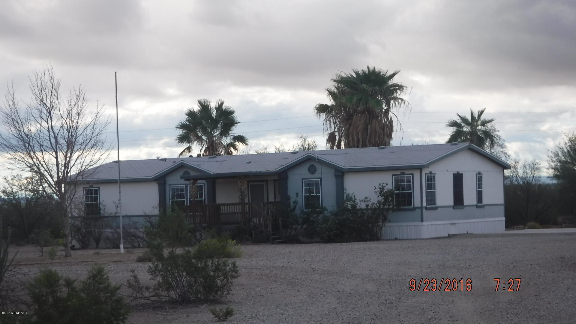 Room to Roam! Lots of land. This 4.68 acre parcel comes with a spacious 3BR 2 Bath Manufacutured home. With minimal repairs this could be a gem. Located on paved roads, GO SHOW!  Don't miss this one. Sold as is with no warranties implied or expressed. Agents see remarks below for contract requirements.