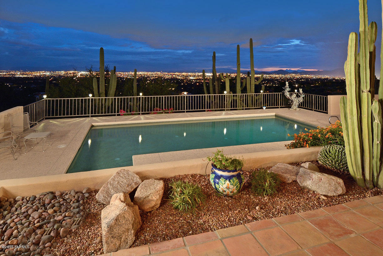 Look no further...if you want character, soaring ceilings, unparalleled views, first rate quality remodeling and masonry stucco construction, this is it. Located at the top of Skyline Country Club Estates, this southwestern style offers beamed and planked ceilings, clerestory windows, sweeping city views from all south facing windows, mountain views from all north facing windows, remodeled baths and kitchen. Gourmet kitchen features custom cabinets, granite counters, designer stainless steel appliances, Viking frig/freezer. Adjacent family room boasts cozy fireplace, built-ins, beamed and planked ceilings. Many designer and art touches, pounded brass sink, hand painted door and oil rubbed brass fixtures. Gracious master suite offers party shower and bath spa.