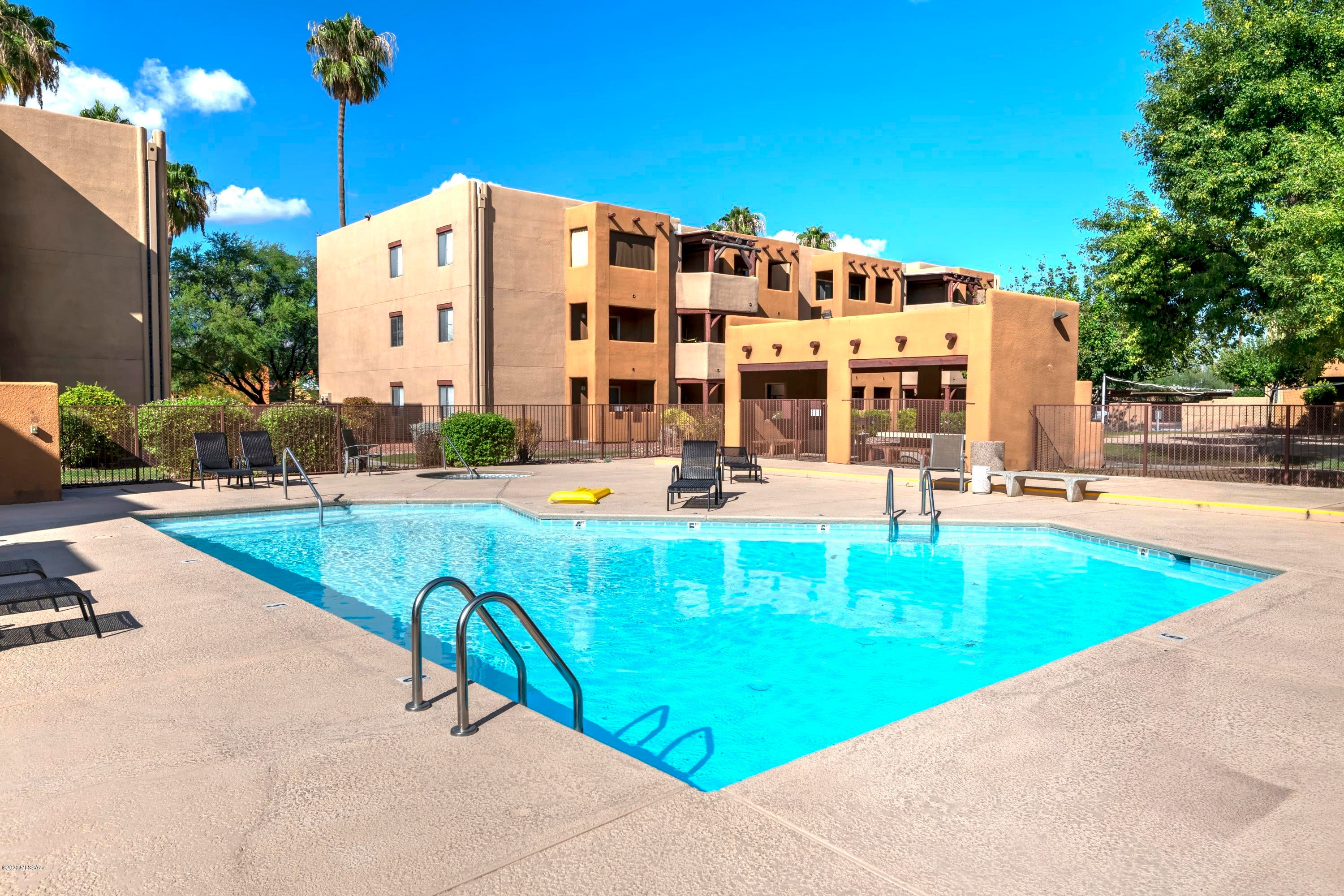 Private second floor condo with Catalina Mountain views in the popular gated Central Tucson community of Casa Club Condominiums. This charming property is conveniently located near shopping, numerous restaurants & The U of A and features an open floor plan, kitchen with stainless steel appliances & tile counters, covered East facing balcony, master suite with walk-in closet, ceramic tile flooring everywhere except bedrooms, additional storage off balcony and resort style amenities. The Casa Club Condos included two community pools & spas, tennis court, racquetball court, exercise room, sand volleyball and spacious clubhouse.