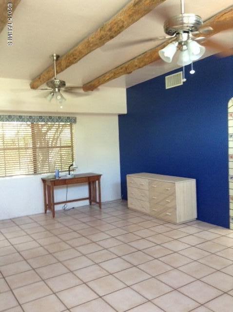 House and guesthouse on this large R2 lot. House was built in 1962, guesthouse was built in 1992. Both well taken care of and have been rented out since 1995. Front house has 3 good sized bedrooms, 2 full baths and approx 1,400 sq ft. Bathrooms and kitchen were redone in 2008. Tile floors throughout with carpeting the bedrooms. Dual cooling and all appliances.
Guest house is approx 1,000 sq ft and very, very cute. House is 2 bedroom, 1 1/2 baths. Master bedroom has a fireplace and lots of closets. bedroom. High ceilings with vigas in the Great Room. Granite counter tops in the kitchen, custom cabinets and newer appliances.