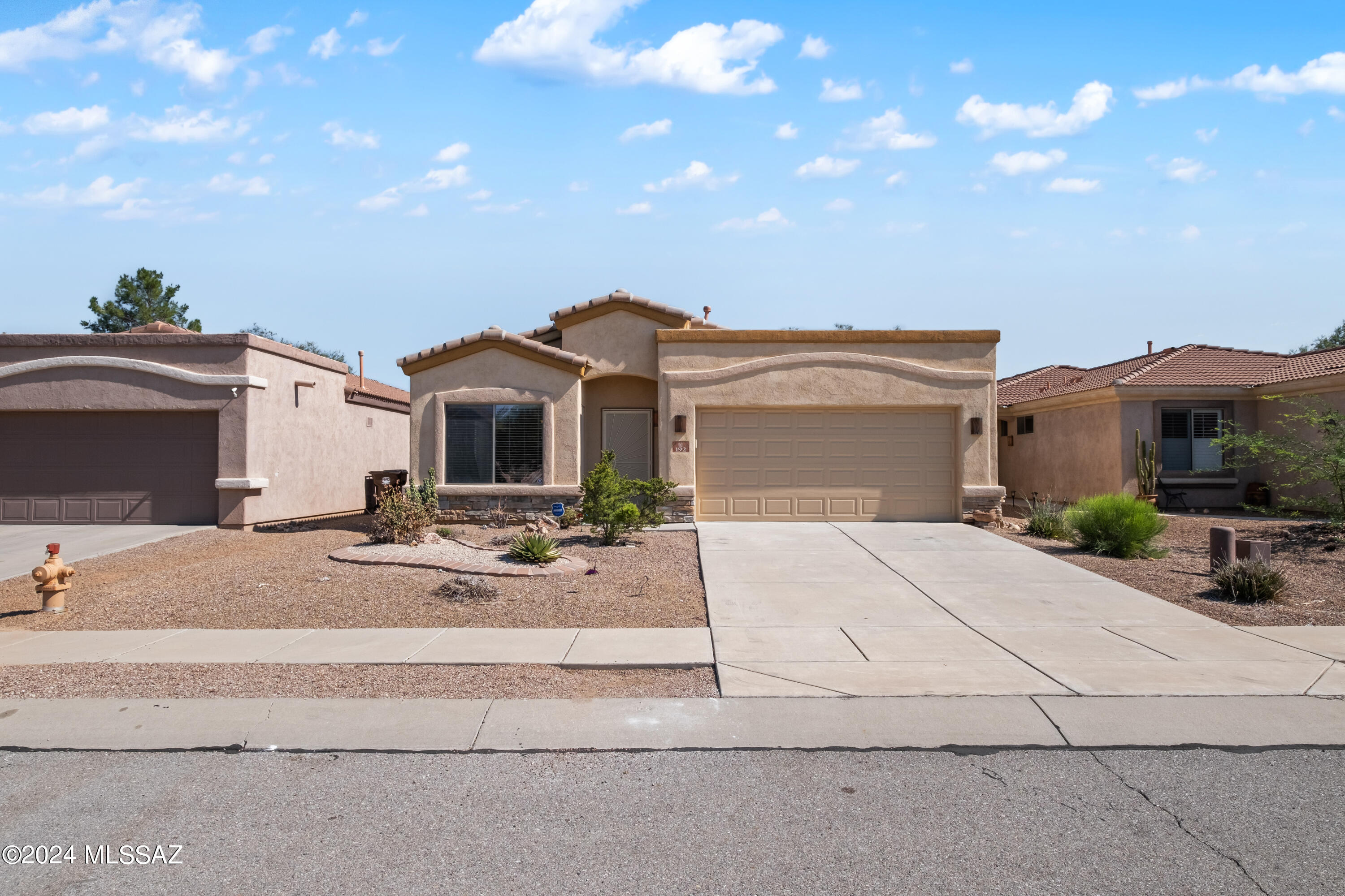 RANGE PRICING $295,000-$305,000 INCREDIBLE DEAL ALERT! This range price makes this home an exceptional deal and is priced to SELL! The range pricing allows the seller to help you with closing costs if desired or for you to walk into a home under 300k! Beautiful single story home with 4 bedrooms in the award winning, amenity rich community of Rancho Sahuarita. This home is perfectly situated on a cul-de-sac with no rear neighbors. When you walk in to the home you will notice the gleaming laminate flooring in the large front room. This room is perfect for a formal living area and dining room, office, playroom, or anything else you can imagine. The open kitchen has an island, granite counters and a dining space. The great room has a cozy gas fireplace and built in entertainment center. The relaxing primary suite has a separate tiled shower, garden tub and travertine counters. A new water heater was installed just last year. This home also has leased solar with a fixed low monthly payment. Come check out all that it has to offer!
