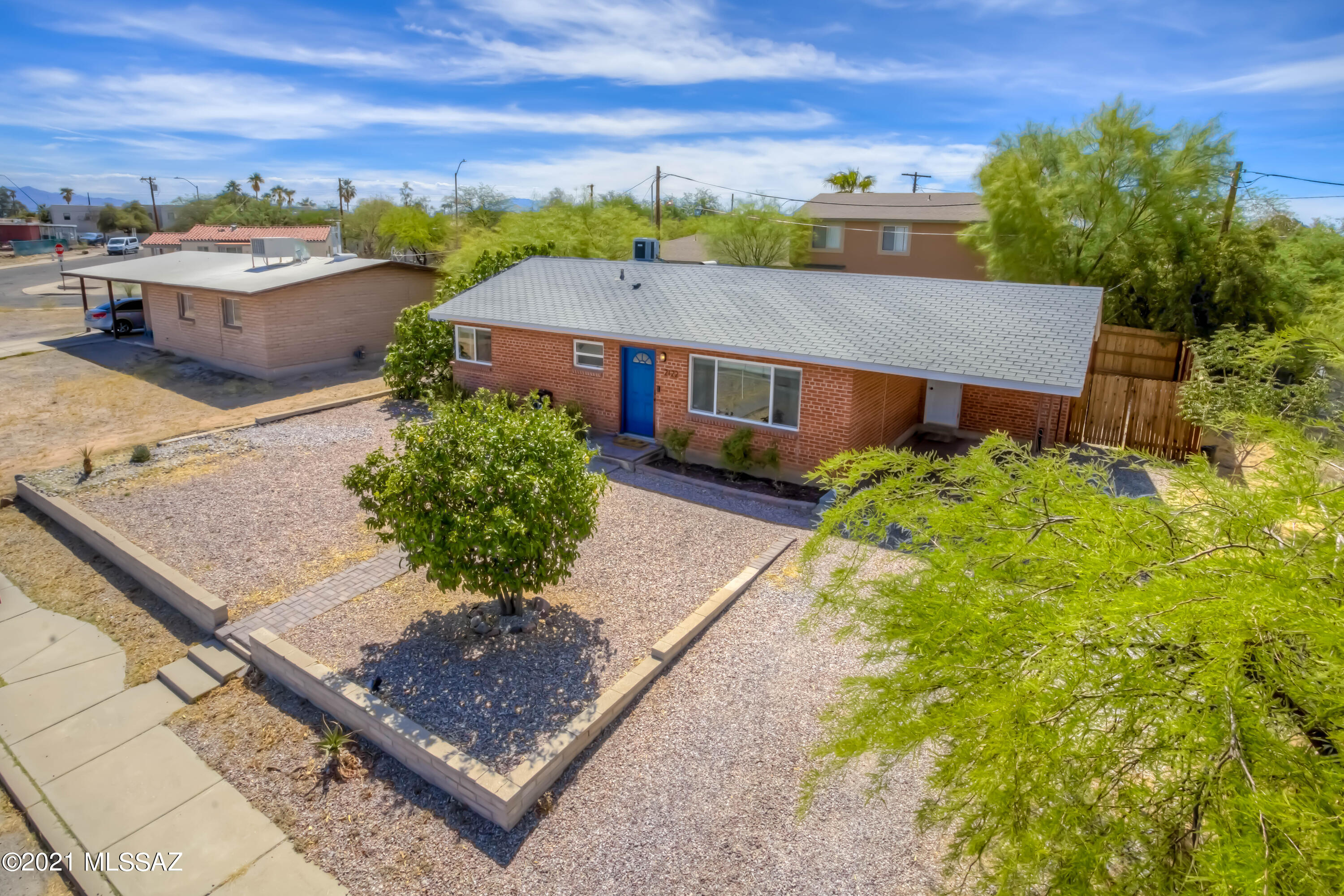 This delightful, lovingly updated and appointed ranch bungalow features neutral, ceramic tile throughout, open kitchen with granite counters and stainless appliances including gas range, and dual pane windows! Plenty of natural light throughout! This home shows like a model and is move in ready. Generous front and backyard spaces, including a paver patio, extra storage, and newer wood fencing. Just minutes from UArizona, making this an optimal central location!