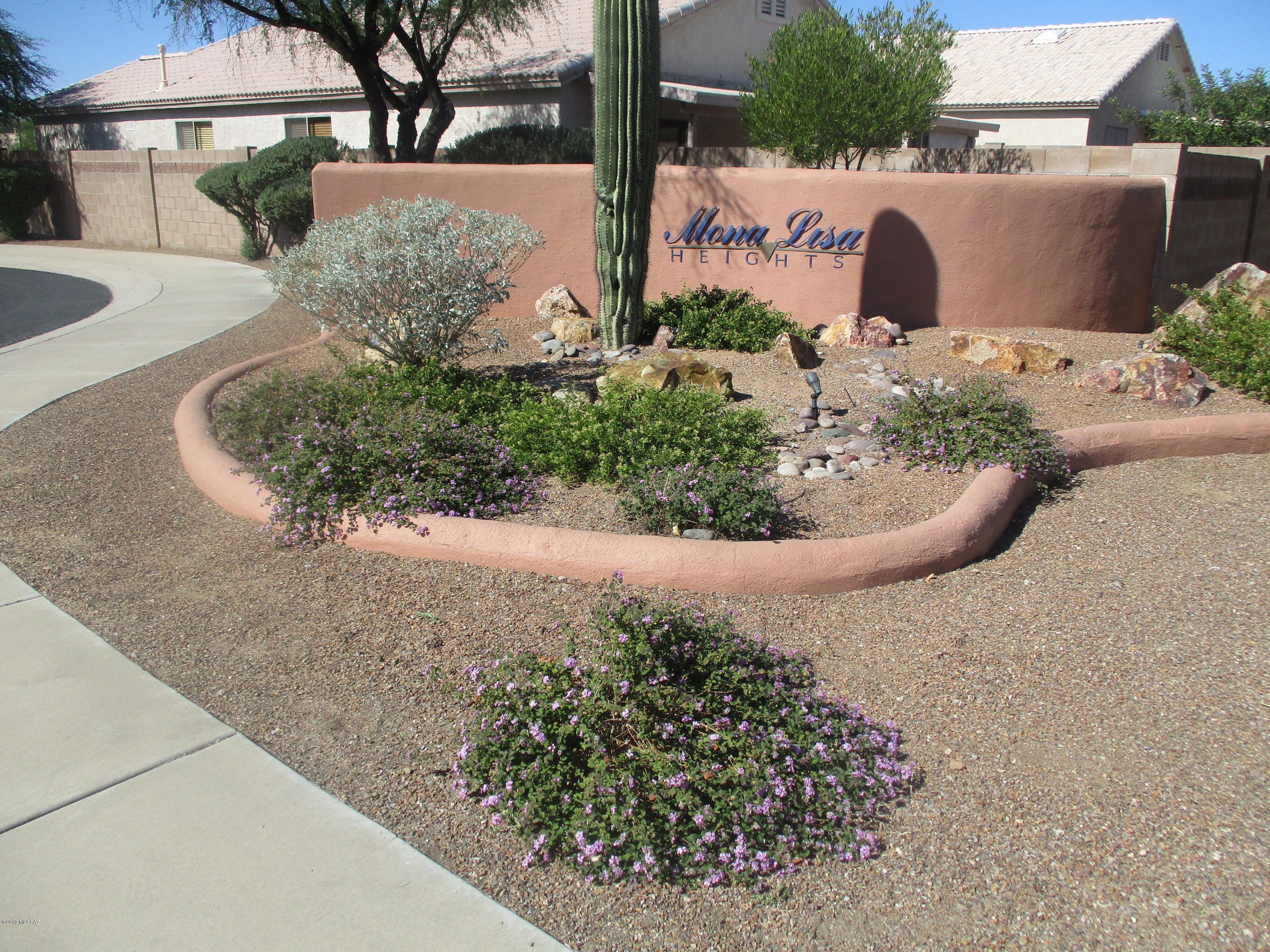 Northwest gated community.  Wonderful 3 bedroom, 2 full baths, 1642 sq. ft home with open eat in kitchen, including pantry closet, pull out shelving, reverse osmosis & ice maker.  Third bedroom 10x20 could be split for office or sitting area.  Tile thru out home.  Washer & dryer.  Above head storage in garage.  Water softener, full covered patio & best of all solar.  TEP bill runs about $15.00 per month.