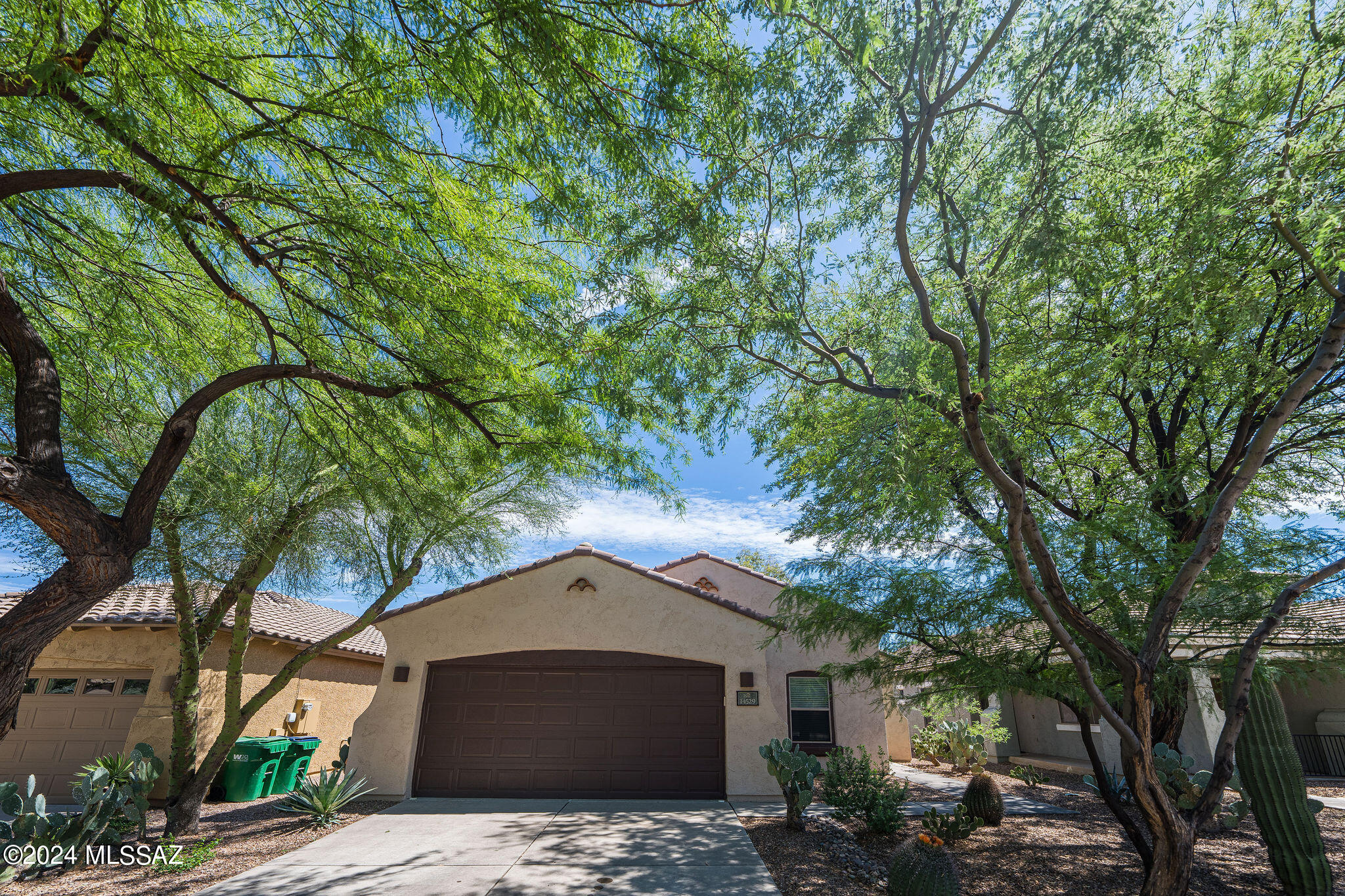LOOK NO FURTHER!  Enjoy all that Rancho Sahuarita has to offer and convenience of location.  From pools, the lake, rec areas and more, Rancho Sahuarita has something for everyone.  Plus, it's a convenient drive to the airport and Tucson.  This one-owner home in a nicely established neighborhood has been impeccably maintained throughout its life, and is ready for you to move in!  Spacious great room, large eat-in kitchen, primary bedroom with en suite and mature landscaping are waiting for you.   A large open area behind you gives you space and privacy.  Come see it today