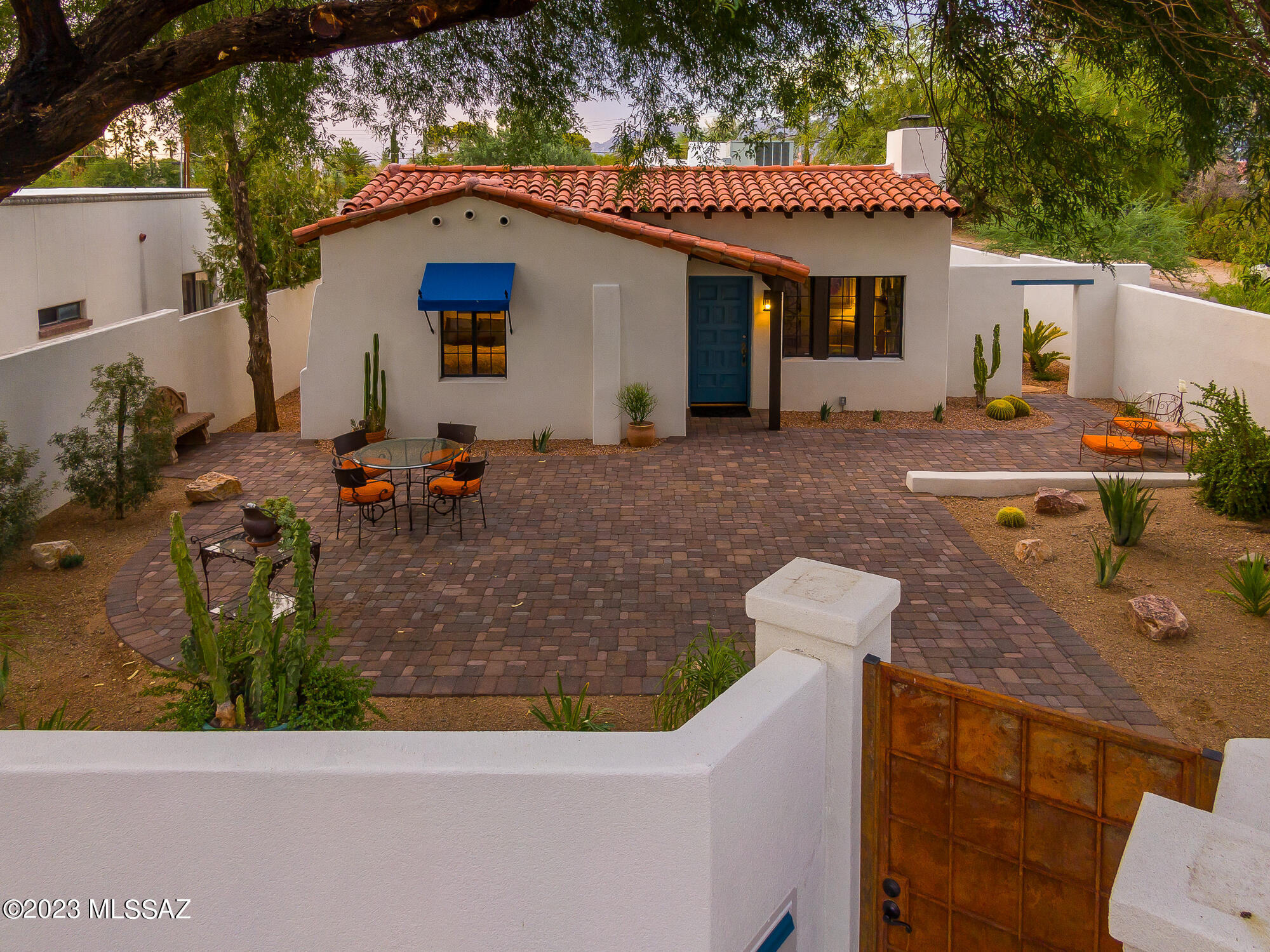 Built by Josias Joesler, 1937. Listed in ''National Register of Historic Places''. A Property of Distinction, now revitalized and preserved with the quality of today's ''High Style''. The home is a tribute to Tucson's most influential architect, once described as an ''Architectural Linguist''. 2BR/1B Home and attached BR/BA Guest Quarters are joined by a private 245 sq. ft. ''Pool Cabana'' outdoor room overlooking pool and enchanting rear yard. MTN views! Corner Lot! Stone Terraced Patios. Custom Iron Gates. Charming walkways, patios and prized cacti connect front & rear yards. New Underground utilities to ensure the wonder of the property remains unobstructed. Plus, new 220 electric to garage gives a nod to a future of electric cars. A Tucson Treasure , an Enchanting Joesler Home.