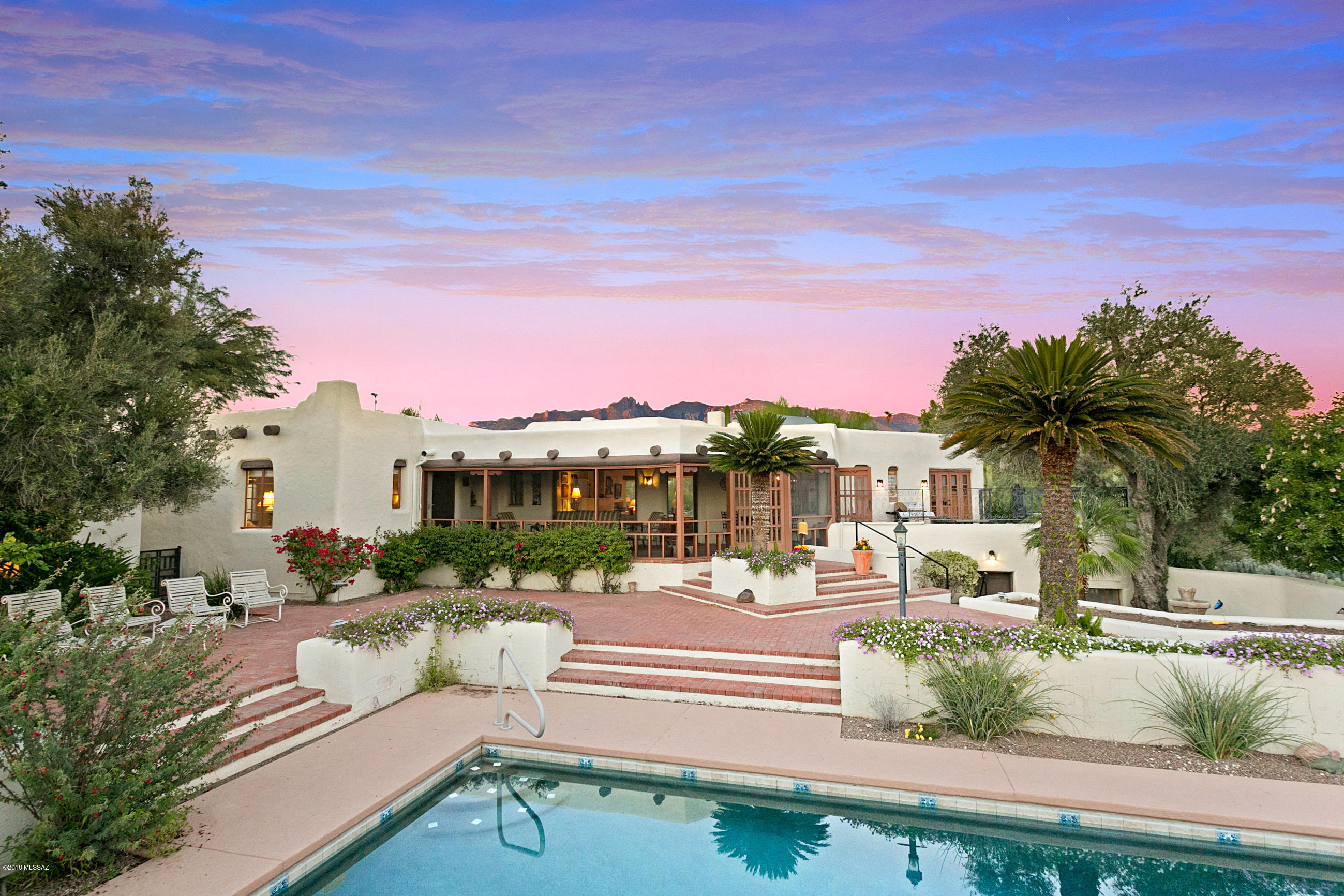 A TIMELESS JOESLER CLASSIC IN THE ''OLD'' CATALINA FOOTHILLS. Sited on a ridge top 3.35 acre 360 view lot, this masterpiece offers the very best of the Tucson lifestyle. The perfect placement, solid adobe/masonry/stucco construction, charming details, with all the kitchen/bathroom and mechanical systems beautifully maintained and upgraded to today's standards - a true delight. Multiple level open and shaded patios, a huge screened beamed ceiling entry porch, an outdoor view dining patio and all the charming interior spaces, details and finishes in the finest Joesler tradition. Also a detached 835 SQF 2BR/Full Bath/Kitchenette Guest House for extended family/visitors. Plus, a detached additional 2 car garage and work shop. Pool, gardens, 11 fruit/nut trees. 1st time available in 45+ years.