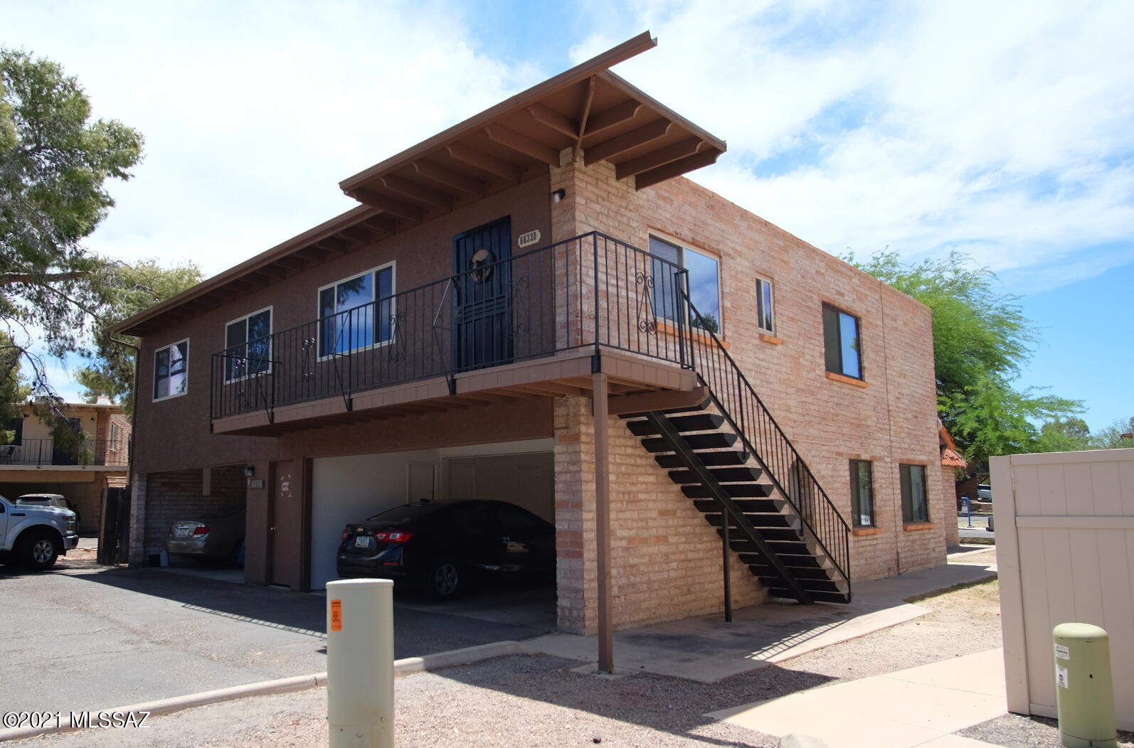 This freshly updated 2 Bedroom/1 Bathroom upper level 838sf Townhome in The Meadows Community has fresh interior paint; woodgrain laminate and stone ceramic tile floors throughout; updated and open kitchen with newer cabinets, countertops, and appliances; central air conditioning; 1 assigned car port space; shared laundry ; and Community features include 2 pools plus plenty of open Common Area for dog walks and enjoyment. Located near Tanque Verde and Kolb for easy access to all the East Side of Tucson has to offer. 12 month minimum lease, $50/adult Application Fee, $1000.00 Security Deposit, $150/pet Pet Fee with approved pet, $250 cleaning fee. Sewer, water, and trash included in rent. Tenant pays electric and gas. 6mo Lease rate is $1250.