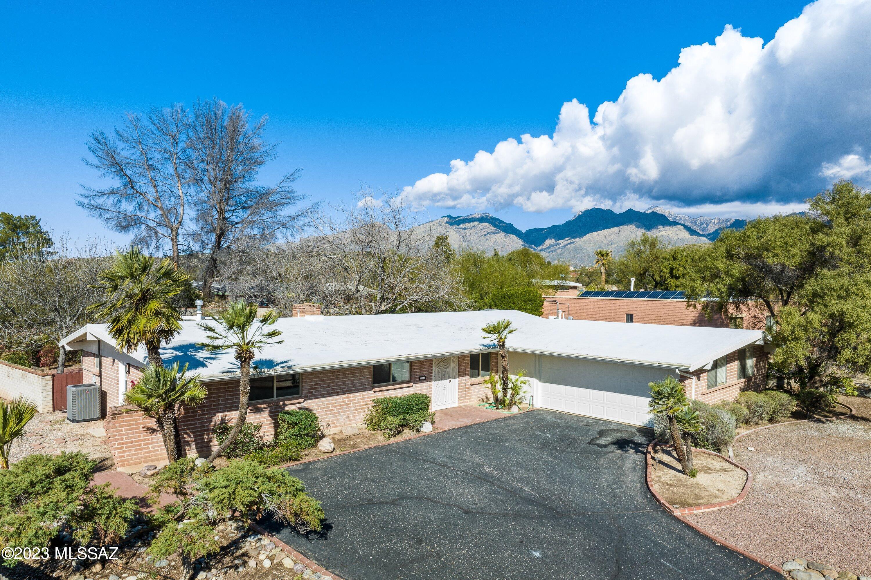 Range price - Seller will accept or counter offers between $550,000 and $600,000. Welcome to Sabino Vista! This home is turn key. Features include large open floor plan approx. 2019 sq. ft. This 3-bed/2 bath home was completely updated in 2022.  Improvements include new solid wood slow-close cabinetry throughout, never used stainless-steel appliances, custom granite countertops, fresh exterior/interior paint, new flooring throughout, large walk-in primary suite shower, mature landscaping with grass & much more.  Some of the less noticeable improvements include gorgeous kitchen backsplash, baseboards, brushed gold door/cabinet hardware, new roof coating, renovation to the laundry room, etc.  Plenty of outdoor space perfect for entertaining. Nearby schools, Whole Foods, and Sabino Canyon.