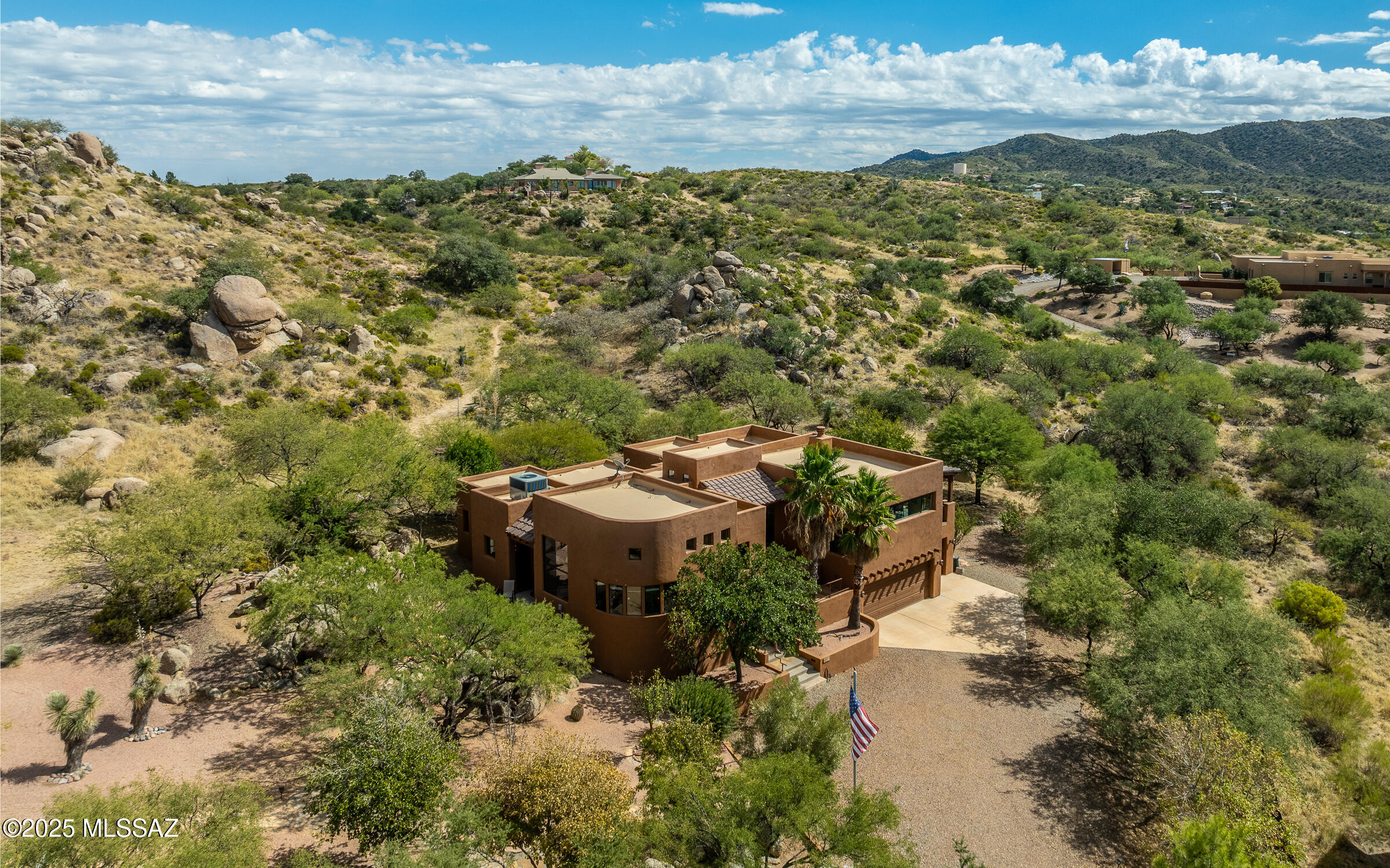 Beautiful custom home on 1 acre plus two additional parcels for a combined 3 private acres! End-of-road location with no neighbors on three sides offers ultimate seclusion. Spacious split floor plan, high ceilings, arched doorways, and a massive antique front door. Living room and primary suite both open to a deck with stunning mountain and city light views. Remodeled kitchen, custom wood doors and baseboards throughout. Primary suite includes private sitting area and direct deck access. Downstairs garage/workshop with 220-amp service. Natural rock formations, mature shade trees, apricot, plum, and pear trees. Walk straight from your door to miles of hiking trails. Extra parcels allow for building 2 more homes, keeping for privacy, or future investment. An opportunity for a true retreat!