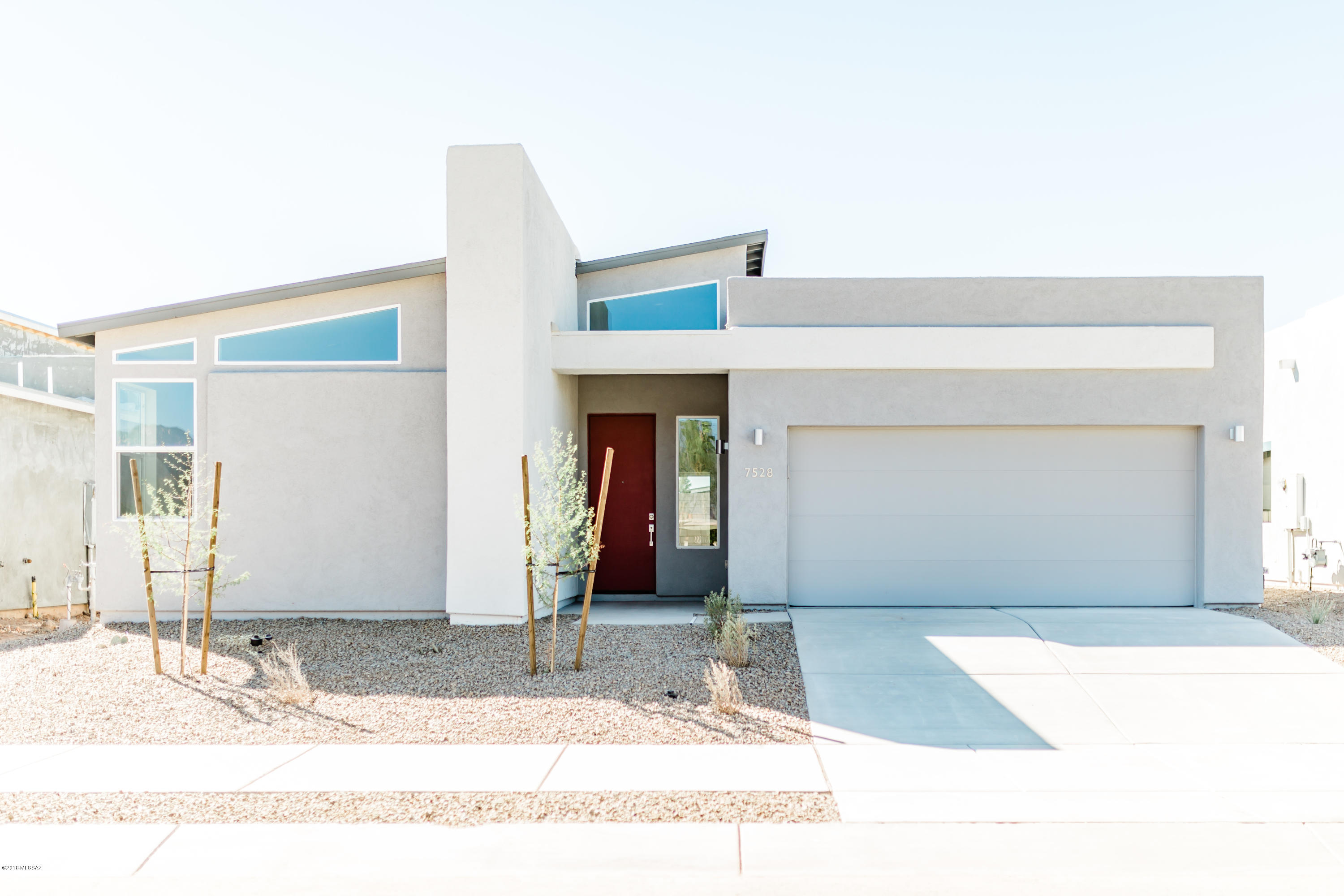 READY TO MOVE IN!! Located in a serene northeast neighborhood adjacent to Udall Park minutes from shopping, restaurants & more! Enjoy this open, mid-century, split bedroom plan with 2' extension to the garage. Patio entrance with blinds from living & master suite.  Master suite also includes a jacuzzi tub & oversize linen closet! Enjoy the gourmet kitchen-double wall ovens and slate stainless steel appliances. Includes Nest thermostat & built-in technology ''SmartHome'' to control security, heating & cooling system.  See list of additional features/upgrades.  Built by Pepper Viner Homes, SAHBA's six-time builder of the year & Arizona Daily Star's 2018 Builder of the Year for New Homes. Confirm final pricing, floor plan and options with the On-Site Sales Associate. Photos are of model home