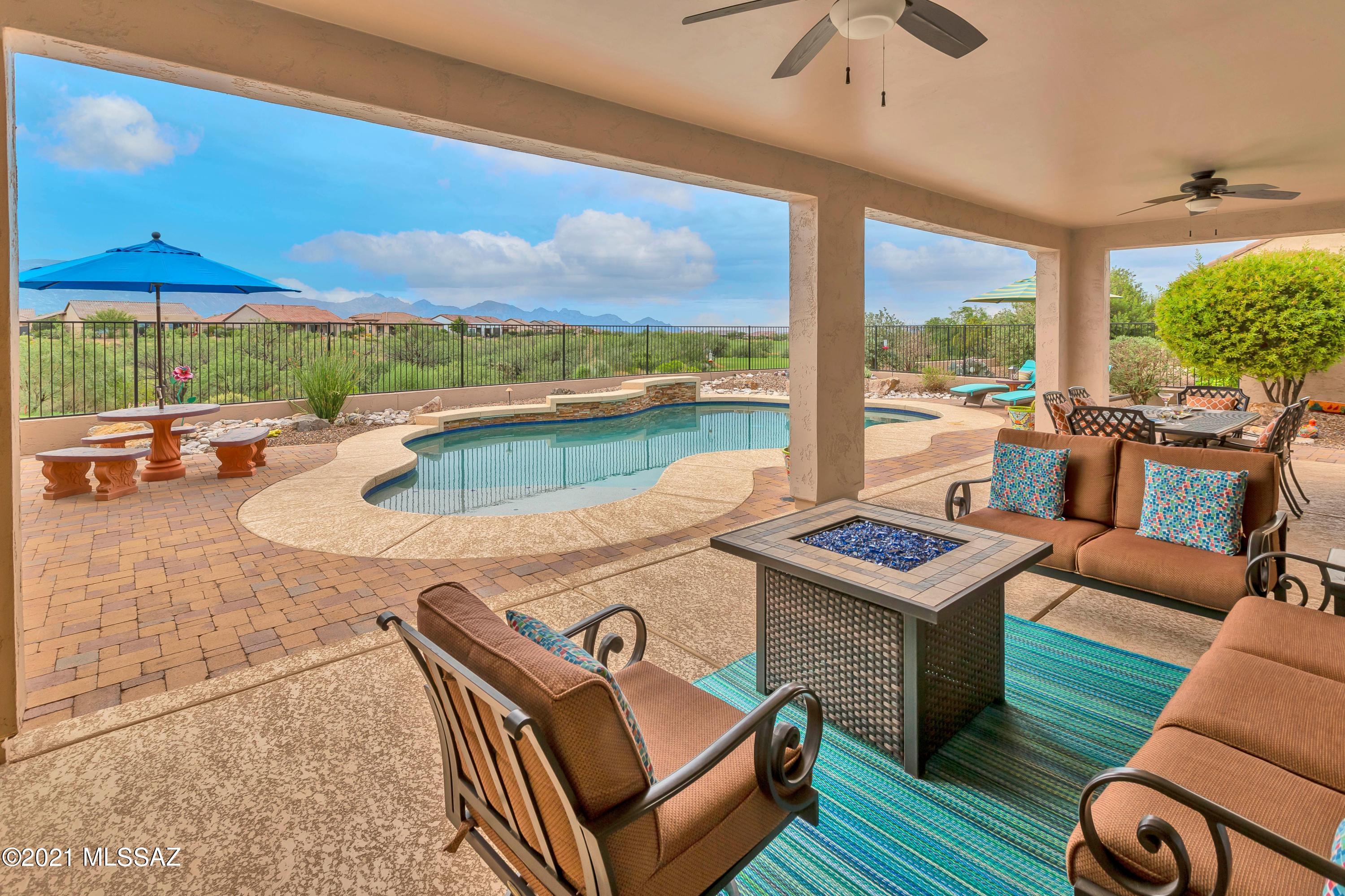 This beautiful Mirasol model has it all; Mountain View, Golf Course, Pool on a cul-de-sac. The backyard is perfect for entertaining or just relaxing. Built-in BBQ with Ramada, pool has both a solar heating system and a traditional heater – swim year round. The kitchen boasts Thermador appliances, granite counter tops, soft close draws, roll-outs and lots of storage. Great room offers expansive mountain views, a fireplace and bar area. The courtyard offers privacy and a gas fireplace. The casita is perfect for your guests or as a craft/hobby room. The options and upgrades on this are too numerous to list – you must see this home. Why wait to build new when you can move in quickly and start enjoying all that SaddleBrooke Ranch has to offer?