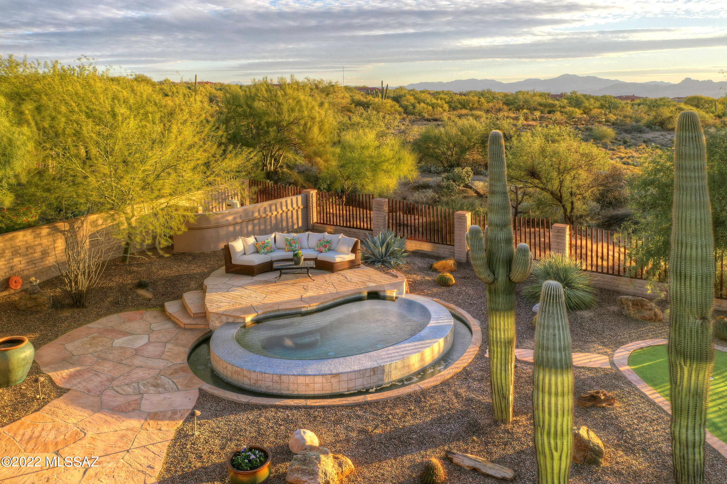 * DESERT PARADISE*- ELEGANT DECORATED SW CONTEMP- QUALTY BUILT BY TOLL BROS...NESTLED ON PREM LOT OVERLOOKING GALLERY NORTH COURSE! FOREVER MTN/SUNSET/CITY VIEWS! ENJOY TUCSON'S OUTDOOR LIVING! VACATION @HOME- SPARKLING HEATED/JETTED SPOOL, COZY FP- CHAT AREA, TONS OF PATIOS, EVEN YOUR OWN PUTTING GREEN!
MAGICAL COURTYARD...SOARING ''CUSTOM DESIGNED''  ENTRY GATE, BUILT IN FIRELINE, BBQ/+ BURNER ,PLANTERS FILLED W/FLOWERS & STRING LIGHTING CREATE A WONDERFUL RETREAT! FABULOUS FLRPLAN WRAPS AROUND THE CTYD- SLIDERS & DOORS TO SEVERAL PATIO AREAS,  CASITA OFFERS HUGE LIVING ROOM- KITCHENETTE AREA/BUILT INS + FULL BEDROOM/BATH- PERFECT FOR YOUR GUESTS/MOTHER IN LAW SUITE! ''BRAND NEW'' PRIMARY BA- MARBLE CTRS, AIR FREE STANDING TUB, MODERN DESIGN/TILE. *BONUS RM* DEN/OFFICE
VERY SPECIAL HOM