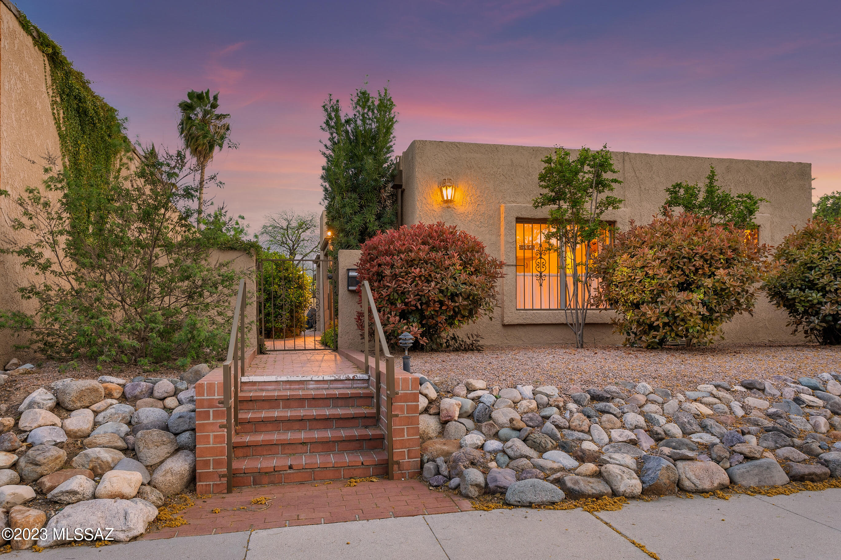 Ideally located in the Arizona Inn neighborhood, First Time Ever! on the market. Your own private, quiet in-town oasis offering the very best of our in-door/outdoor lifestyle. Well built, well maintained, carefully updated, exceptional detailing. Gated courtyard entry, welcoming foyer, spacious living room opens to private outdoor patio. Large dining room for family and guests. Updated stainless steel kitchen with dining area opens to covered outdoor patio with BBQ. Main bedroom, bath and a sitting area open to a private patio. Large 2nd bedroom adjoins main suite offering a flexible floor plan for an office, studio or double mains. Also a spacious split 3rd bedroom with hall bath. Across the backyard and open patios are 1BR/BA Guest Quarters and 2 one car garages both with storage areas.