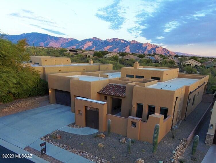 Stunning Renovation in the gated Preserve at Dove Mountain. Thoughtfully updated w/designer finishes including luxurious porcelain tile flooring, top tier quartz countertops, solid core interior doors, premium appliances & so much more. The coveted split floor plan offers a secluded primary suite w/ walk in spa-like shower & spacious closet. Entertaining is a breeze from the beautifully updated kitchen complete w/ an expanded island & wine fridge. Grand living & dining rooms surrounded by clerestory windows fill the space w/ cheerful sunlight. Detached Casita/MIL w/separate entrance off courtyard w/cozy fireplace. Three car garage w/ A/C & fresh epoxied floors. Backing to open space & breathtaking views of the Catalina Mountains. You will never want to leave. Call for private showing !