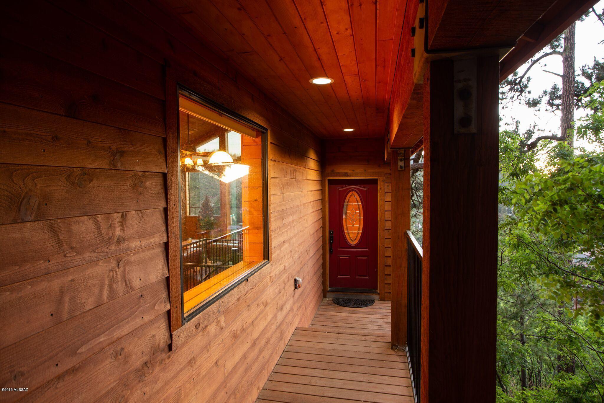 Beautiful log cabin featuring open living space with large kitchen, formal dinning room, breakfast bar and family room with rock fire place. Plenty of natural light and big balcony overlooking Summerhaven. Spacious master bedroom with walking closet and big master bath with dual sinks. Spiral stairs takes you to two more bedrooms, full bath, laundry room and media room. This is a beautiful property to enjoy all year around with family and friends or a great short term rental for extra income, Call today for a private tour!