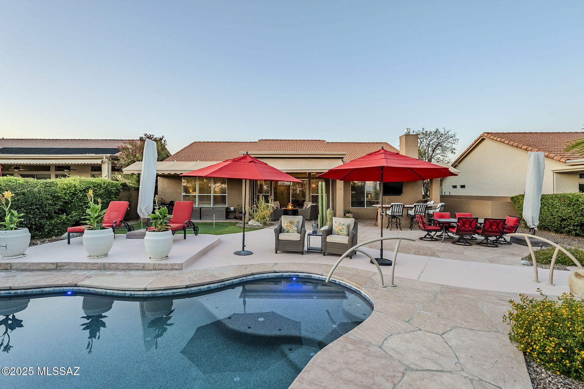 Fabulous entertainer's home in SaddleBrooke One! This fully remodeled Estancia floor plan includes 2 bedrooms + den/office (doubles as guest bedroom overflow) and 2.5 baths, with spacious casita w/updated bathroom, cabinets, mini fridge, and microwave. The private backyard oasis features a heated pool, spa with waterfall, built-in grill with bar seating, outdoor TV, keg fridge, misting system, firepit, retractable awnings, and stunning golf course/mountain views. All tile flooring, remodeled kitchen with gas cooktop, granite, and second island w/seating. Family room has linear fireplace and built-in bar w/bev fridge. Primary suite enjoys mtn views and luxurious bath w/walk-in shower. Extended garage fits 2 cars + golf cart w/attic stairway, sink, man-door and storage. HVAC 2014, WH 2021.