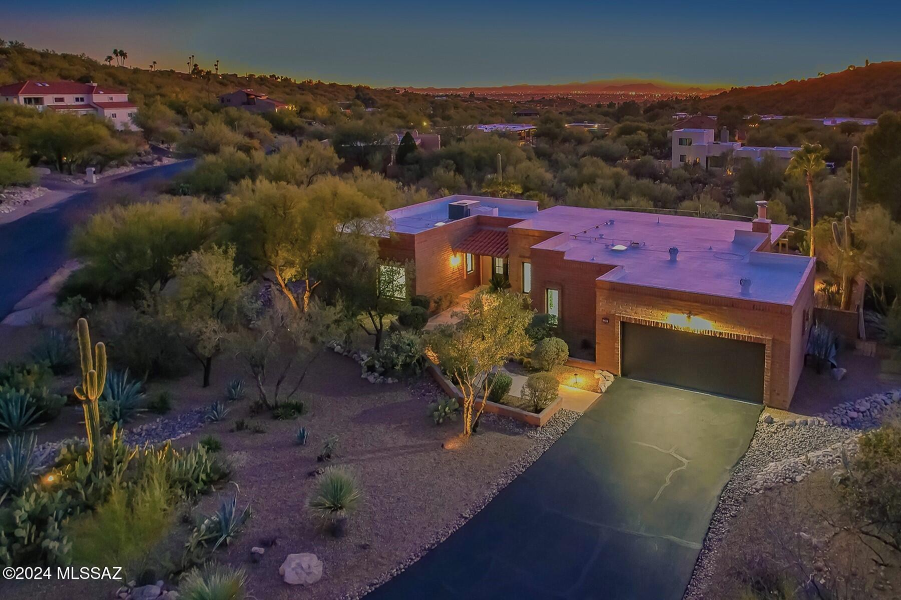 Beautiful Balance of Modern Luxury Living & Authentic Southwestern Appeal. This Classic Burnt Adobe Territorial has been Thoroughly Refreshed & Impeccably Renovated. Amazing 1.29 Acre Lot w/ Sparkling City Lights to the Southwest & Glowing Mountain Sunsets to the North.
Sophisticated Interior Design w/ Gorgeous 48''x24'' Tile Floors, Expanded Open Kitchen Concept & Gorgeous New Bathrooms. Stylish Kitchen Features Quartz Counters, New Appliances, Marble Backsplash & Large Breakfast Bar. Major Improvements: Double Steel Entry Door, Dual Paned Windows & Sliders, Delta Plumbing Fixtures, Fans, Lighting, Interior Doors, Baseboards + Custom Paint. All New Pebble Tec Pool Coating, Pool Deck Coating, Spa Heater, Pool Pump & Light. New Insulated Garage Door, Asphalt Driveway & Epoxy Garage Floor.
