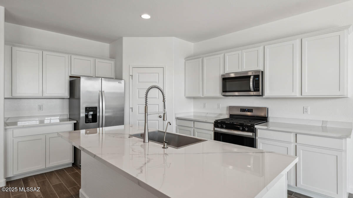 Welcome to your dream home in the desirable Saguaro Bloom community! This beautifully designed single-story home offers 4 generously sized bedrooms and 3 full bathrooms, perfect for families or those seeking extra space for guests or a home office. The open concept split floorplan features a bright and airy great room that seamlessly connects to the modern kitchen, complete with quartz countertops, stainless steel appliances, a large kitchen island and walk in pantry. Includes a three-car garage and is our most energy efficient home featuring spray foam insulation and is zero energy ready! Don't miss your chance to tour this amazing home!