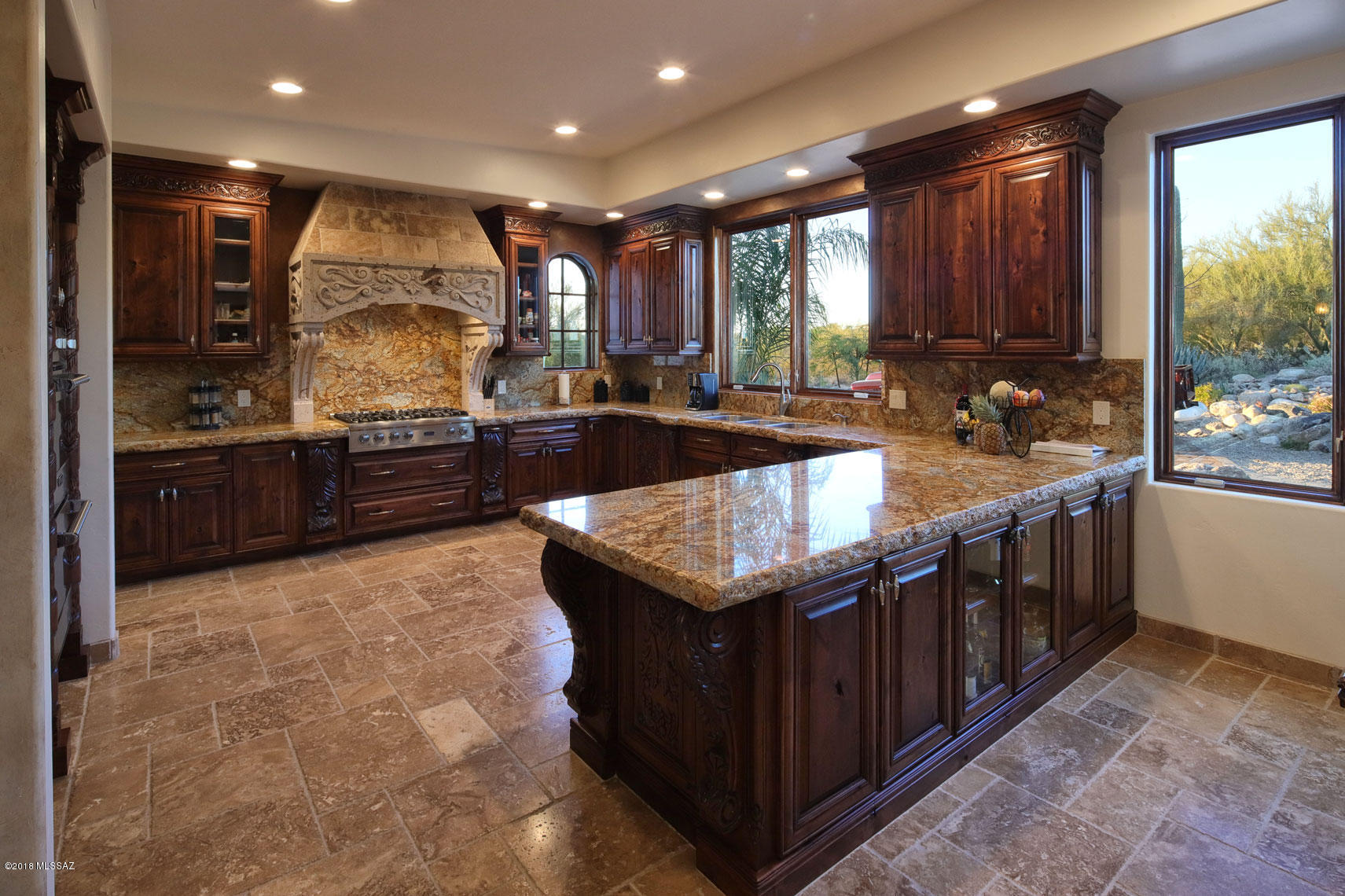 This home was built by Bartholomew Homes as his personal residence. Therefore it has been over built.  The kitchen has the same finishes as Bartholomew Homes uses in there 2.5M homes, Viking appliances 6 burner stove with double ovens, microwave and refrigerator, custom made cabinets, chiseled-edge Granite counter tops with cantera stone hood. The home is 4,147 square feet of living space. This property is also horse property you are allowed to have 2 horses. This home sits on a 1.63 acre hill top with city and mountain views in the Foothills. New brick paved driveway lets to oversized 4 to 6 car and RV garage. Pool, swim up bar, Ramada, shaded pine trees, turf grass. Huge back yard with 2 gated entrances. This beautiful home has a Mediterranean feel and look to it.
This is a MUST see.