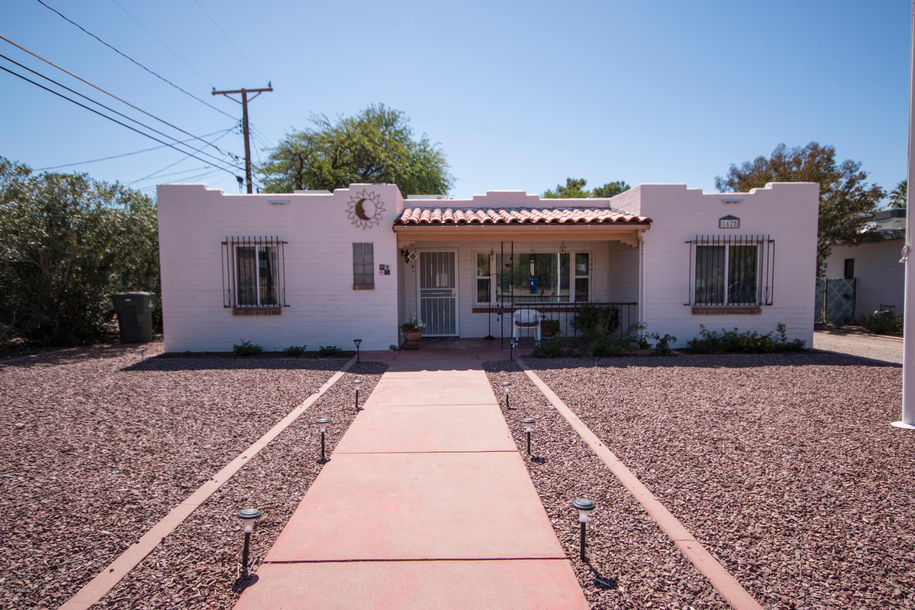 Great home in a peaceful neighborhood with no HOA!! This ranch style home features ceramic tile & carpet flooring, a workshop, and a soothing fireplace in the family room! Step out to the large backyard and enjoy the covered patio & built-in BBQ!  Don't miss out on this incredible opportunity!