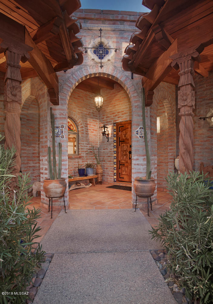 CASA DEL SOL Y LA LUNA - !!!AERIAL VIDEO IS A MUST SEE!!!-COMPLETELY CUSTOM, INCREDIBLY CHARMING HOME ON OVER 3 ACRES WITH PANORAMIC VIEWS. HOME OF DONNA McMENAMIN, WELL-KNOWN AUTHOR OF MEXICAN ARTS & INTERIORS BOOKS BUILT WITH LOVE. WONDERFUL DETAILS & FEATURES ABOUND, HIGH BEAMED CEILINGS, CARVED DOORS AND COLUMNS, BEAUTIFUL TALAVERA TILE. HUGE BUTCHER BLOCK TOPPED ZIG-ZAG SHAPED KITCHEN ISLAND IS FABULOUS! MASTER SITTING WITH FIREPLACE. QUALITY CABINETRY, HARDWARE, FIXTURES, ARCHES GALORE ALL ENHANCE TRUE MEXICAN AMBIANCE. LONG GATED COBBLESTONE DRIVE, COURTYARD ENTRY WITH FOUNTAIN, EXPANSIVE COVERED PATIO IS TRULY AN OUTDOOR ROOM, SPARKLING POOL OVERLOOKS CITY LIGHTS. SURPRISES LIKE HIDDEN CABINETS AND STAINED-GLASS MEDALLION WINDOWS ADD TO THE SENSE OF KNOWING THIS IS A SPECIAL PLACE.