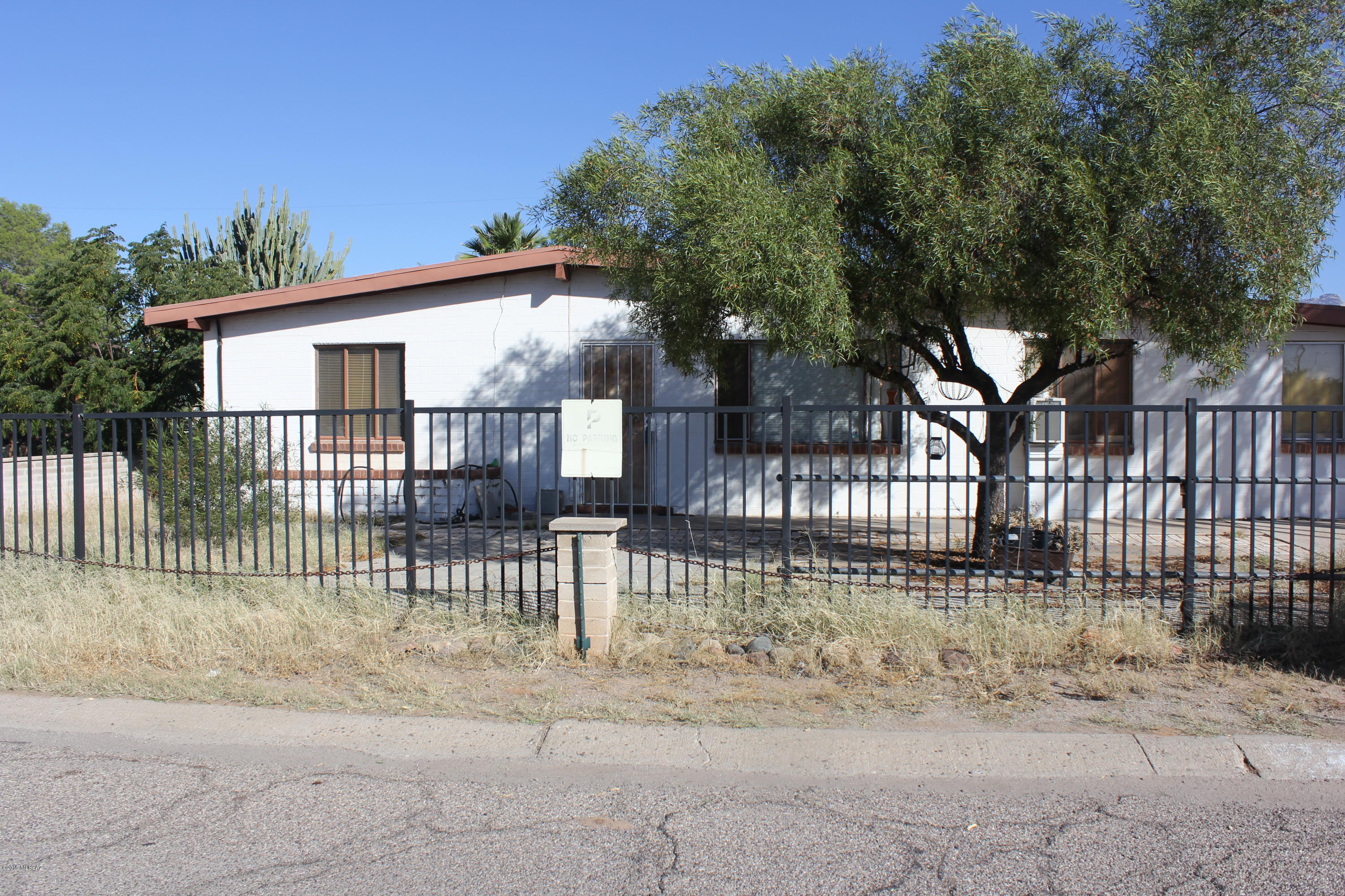 Central 3 bedroom 2 bath home in a well established neighborhood. Large family room and living room off kitchen. Tankless Water Heater. Great mountain views from large back yard.  Needs some TLC. Offered as-is.