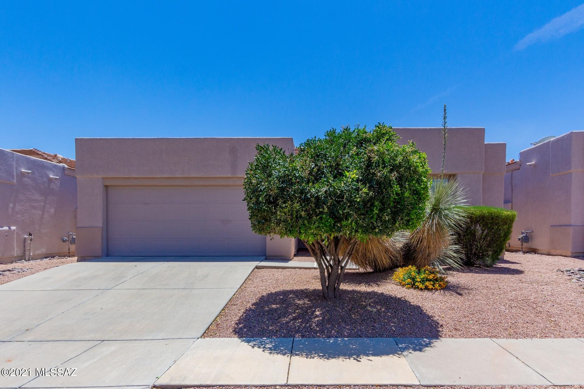 Beautiful, move-in condition home in highly sought after Rancho Esperero !! Gated community with surveillance, & front yard maintenance that offers 3 pools & spas, one heated. This contemporary, high ceiling home boosts 4 bedrooms & 2 baths, as well as all brand new stainless steel kitchen appliances. Kitchen skylight adds to the bright & spacious feeling to this cheerful home.  Perfect patio & manicured yard for relaxing & entertaining. This jewel of a home sits on a cul-de-sac in this friendly & peaceful neighborhood which is walking distance to Udall Park. Close to shopping, restaurants. You'll want to see this one!!