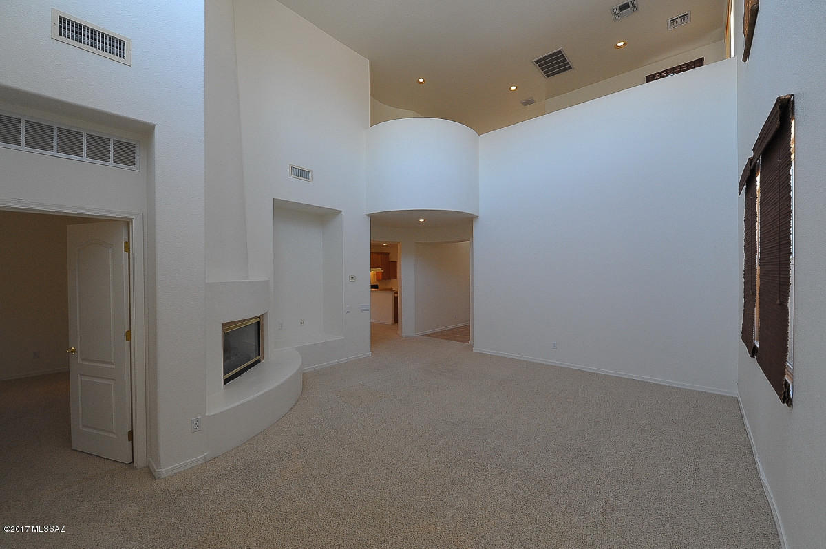 New carpeting, master suite downstairs, 3 bedrooms and loft upstairs, spiral staircase, tandem garage, lush backyard on drip great views.Ask about P#2730-Q