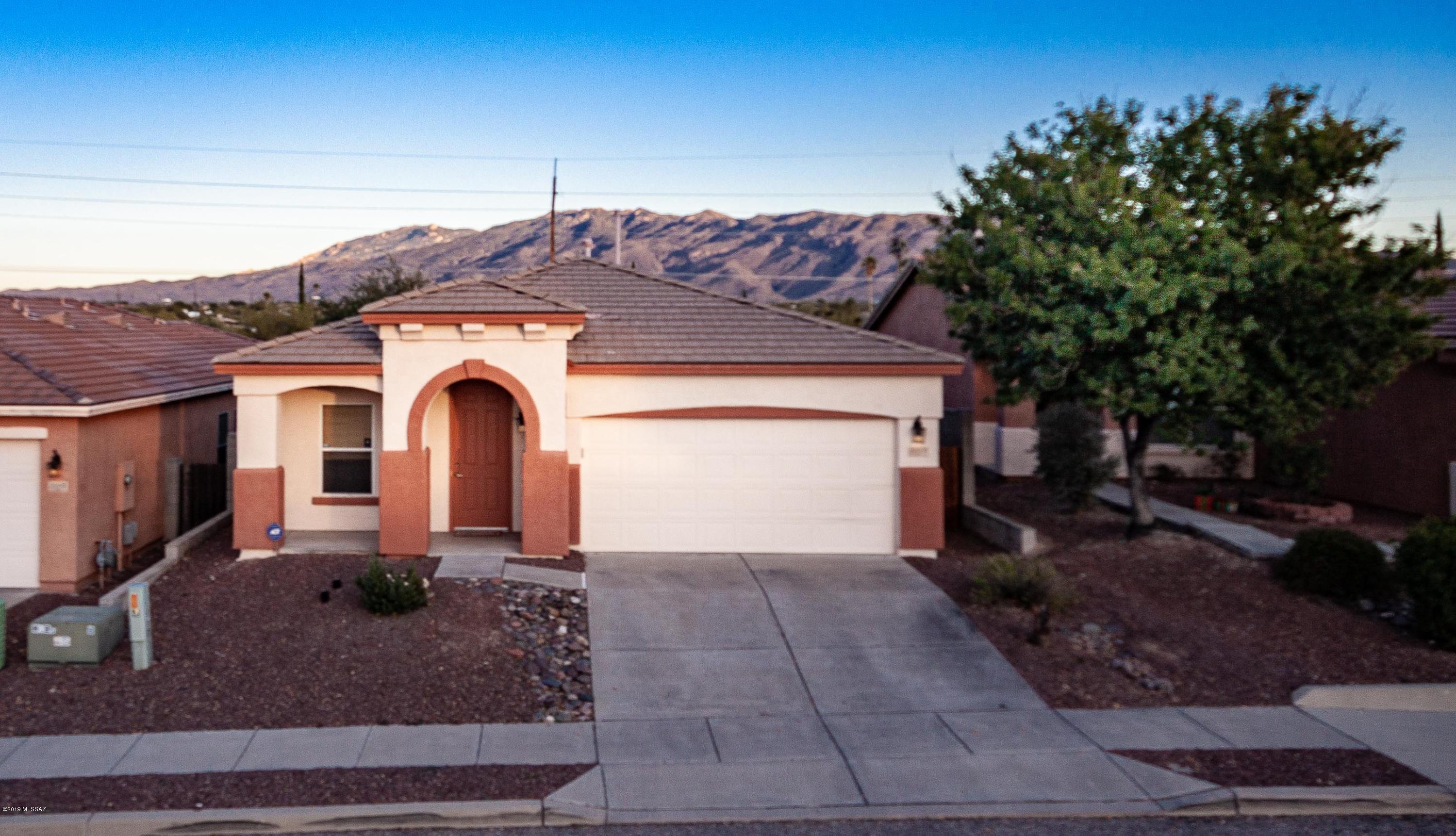 Beautiful 3BR/2BA home in lovely small community @ Houghton/Old Spanish Trl. Walking distance to bike paths, trails, parks, & shopping. Minutes to DMAFB, Raytheon, Leman Academy, I-10, Saguaro National Park. Rincon & Catalina views! Home features a split floor plan w/separate living & family rooms. Tile throughout entire home, no carpet! Spacious master suite has area for seating &l large walk-in closet. En suite has spacious double vanities and garden tub. Kitchen has solid wood 42'' cabinets, stainless steel Frigidaire appliances, w/island & seating. Covered East facing patio w/Rincon & Catalina views. All appliances stay. Truly move-in ready! Come live the good life.. Another Diamond in the Desert.