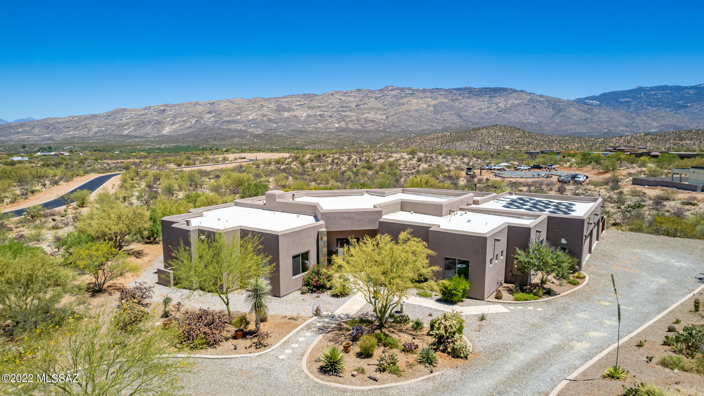 Seller will accept or counter offers between 1,295,000 - 1,450,000. Unique opportunity in desirable Coyote Creek community with hiking/mt biking/horse trails. Tennis and pickle ball courts and community ramada fully equipped for private events. Breathtaking private paradise in 2.86 acres at the foothills of the Rincon Mountains. Unobstructed panoramic mountain and desert views. 45ft Lap Pool with therapy jets and solar coils technology keeps you swimming almost all year round. Relax in your beautifully, professionally landscaped private resort backyard. Gourmet kitchens, dream pantry. Fully stocked outdoor kitchen. 4 bedrooms + Full large office with closet can also be used as 5th bedroom. Mudroom with desk and storage can serve as 2nd office or kids work area. Oversized 4 car garage with an extra room for a workshop or use of your choice. Garage gym available. Energy efficient due to extra insulation. Pre-plumbed for gray water system. A desert oasis. Your dream home come true.