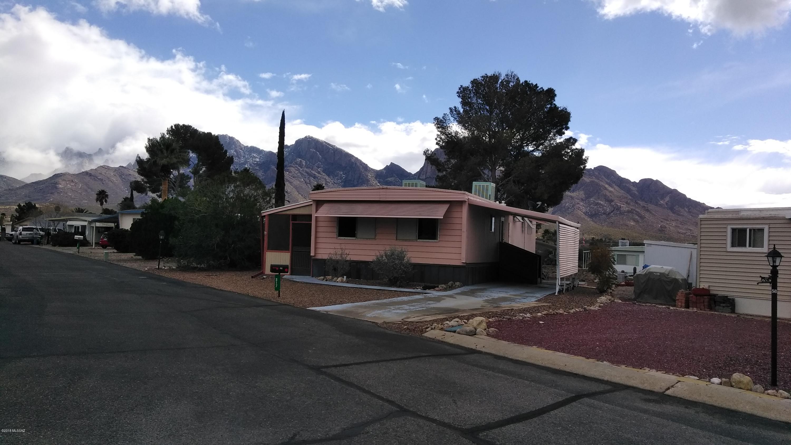 Opportunity knocks twice.  Back on the market due to inability to close.  Hurry...3BR/2BA with many upgrades-floors, carpeting, paint, window screens, fixtures, cabinets and much more. Enjoy peaceful mornings from screened porch with Catalina mountain view.  Stunning kitchen with dishwasher, oven/range, refrigerator and disposal. Newer wood- like flooring.  Laundry is done, washer and dryer included. You'll love the community; an active adult 55+ subdivision and yes, you own the land. Amenities include heated, year round swimming pool/spa and a rec center with a library, kitchen, billiard room and conf. room. HOA is only $58.00/month. Private streets for walking and biking. Take in the view and come home to The Highlands. Pet restrictions-service animal or emotional support animal only.